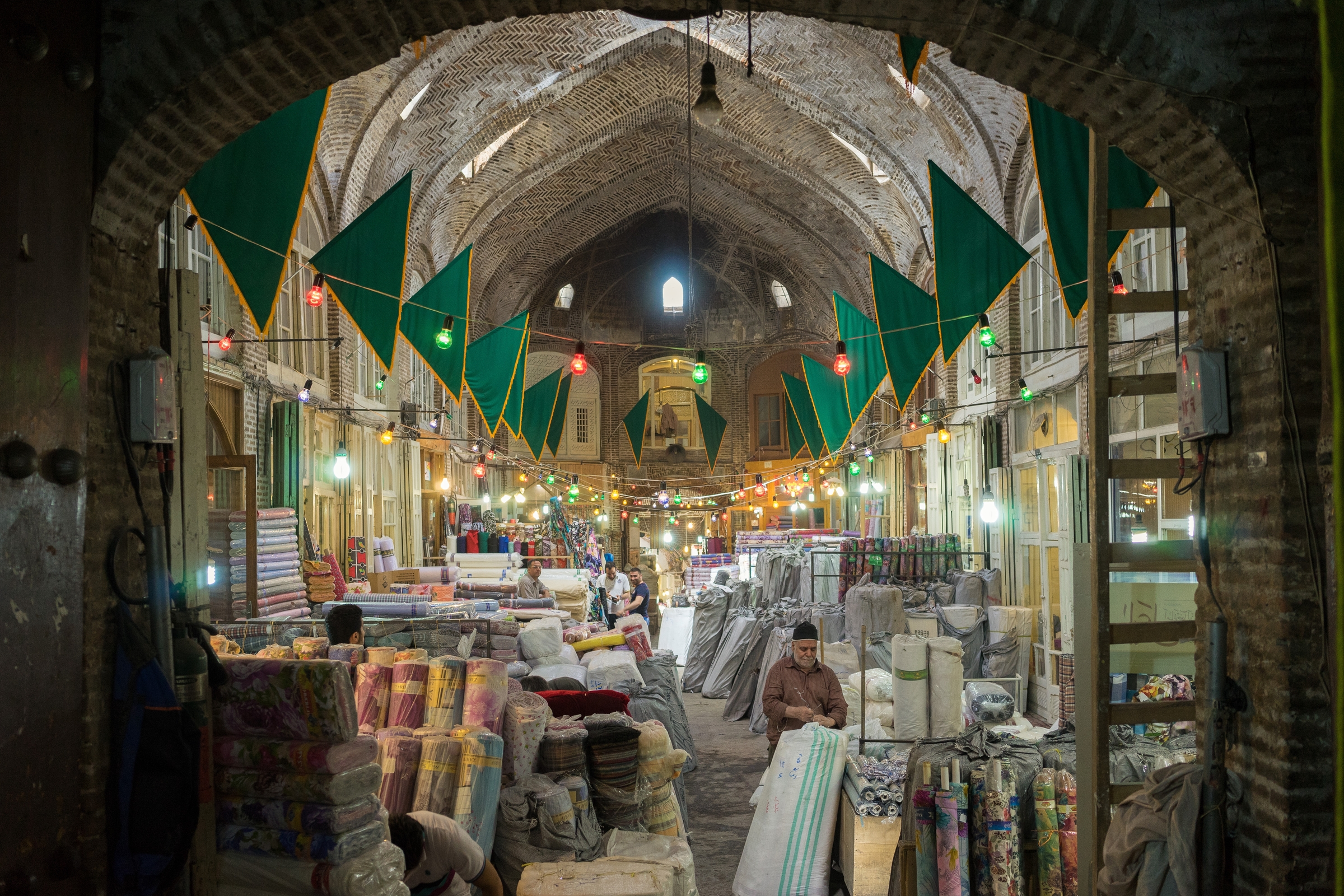  A view of the traditional Iranian bazaar where may Iranians still choose to shop each week. The unique shopping experience in the bazaar, underpinned by personal relationships between the shopkeeper and the consumer, is threatened by the growing pop