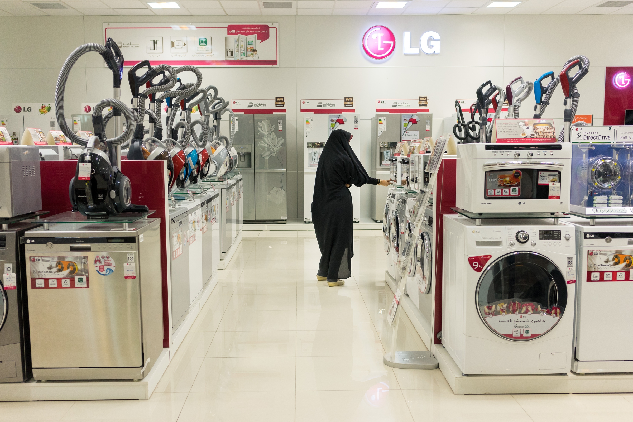  An Iranian woman shops for appliances at the Isfahan City Center Mall, Iran's largest. Foreign appliance manufacturers such as Korea's LG have come to dominate Iran's market. Iran's domestically produced Arj brand ceased operations this year after 8