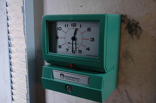Factory punch clock at Fabre's art laboratory. Photographed by Bernard Polet. Via Flickr.