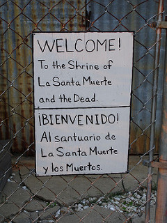 "Santa Muerte 20100601 002" by Jim Hobbs. Via Flickr . A "backyard shrine" to Santa Muerte in the photographer's neighbourhood