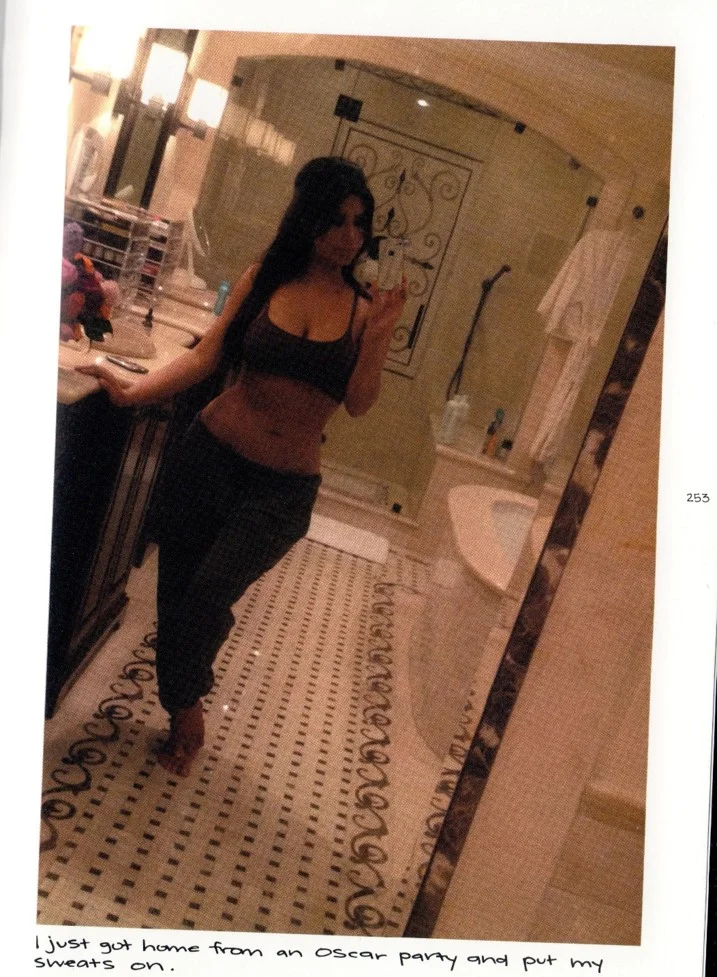 Fig. 3. Scan of Kardashian West, Selfish , p. 253: a selfie of Kardashian West in an opulent bathroom in jogging bottoms and a casual bra top. Caption reads: 'I just got home from an Oscar party and put my sweats on.'