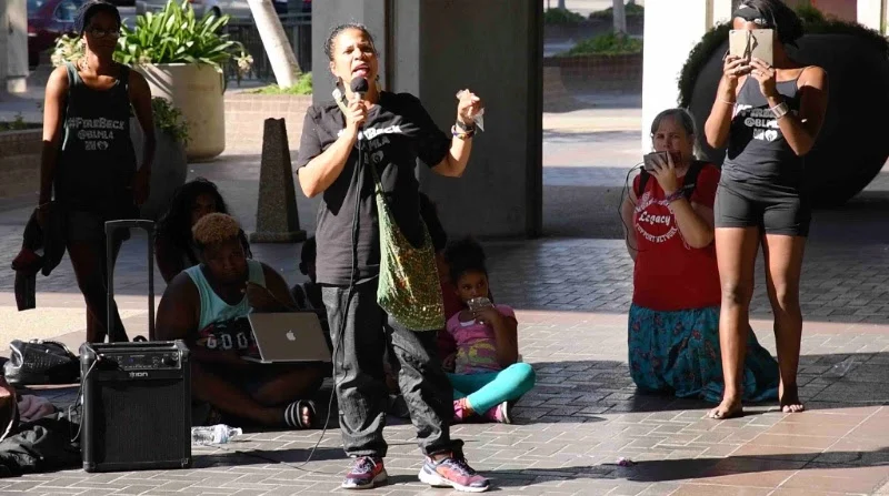Dr. Melina Abdullah , an activist and leader with Black Lives Matter, speaks at the ongoing protest/occupation of Los Angeles City Hall demanding the firing of the police chief in response to repeated police shootings of an unarmed African-Americans.