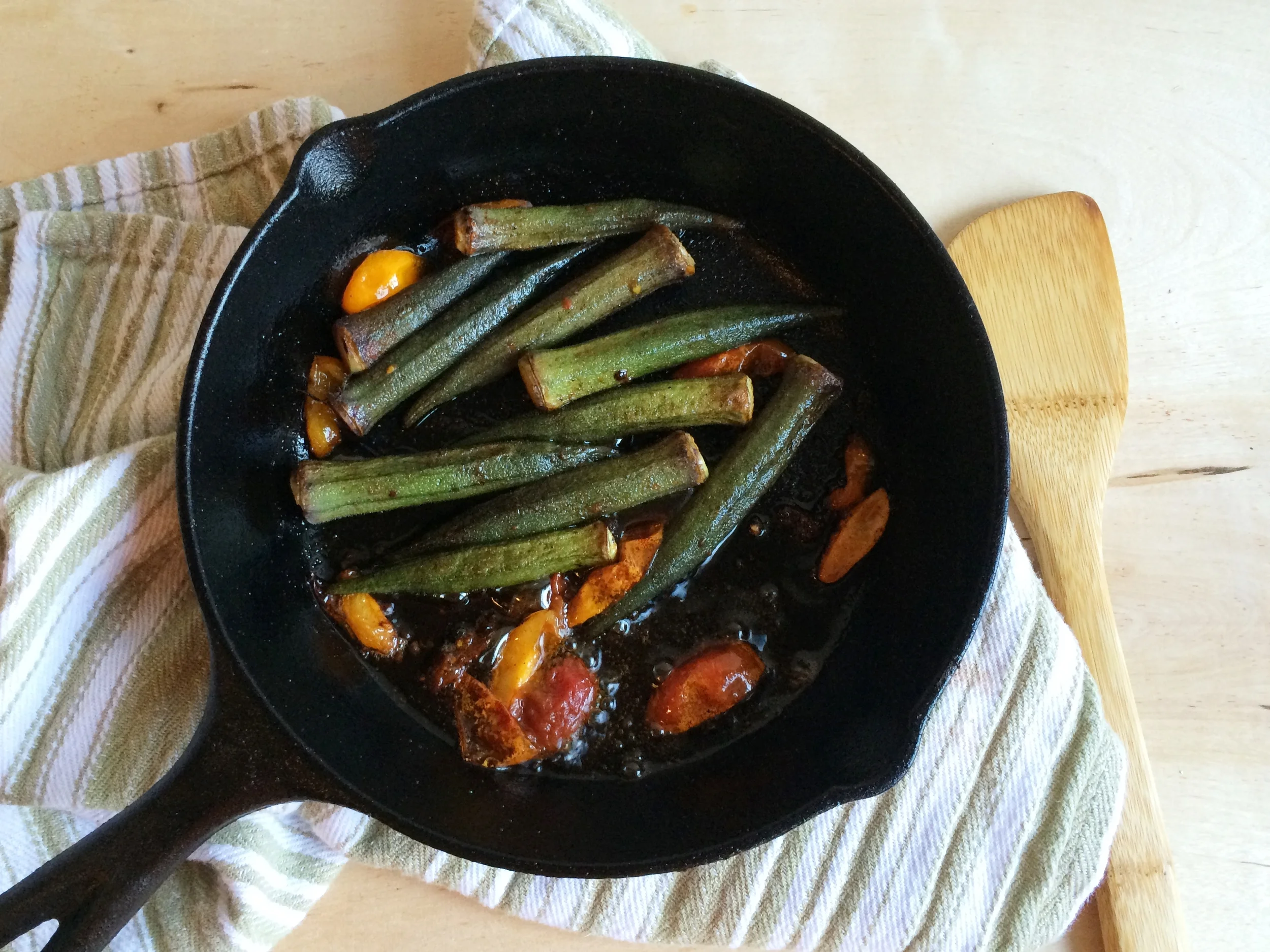I used sliced tomatoes and a little lemon juice for the acid. The red okra turned green while cooking.