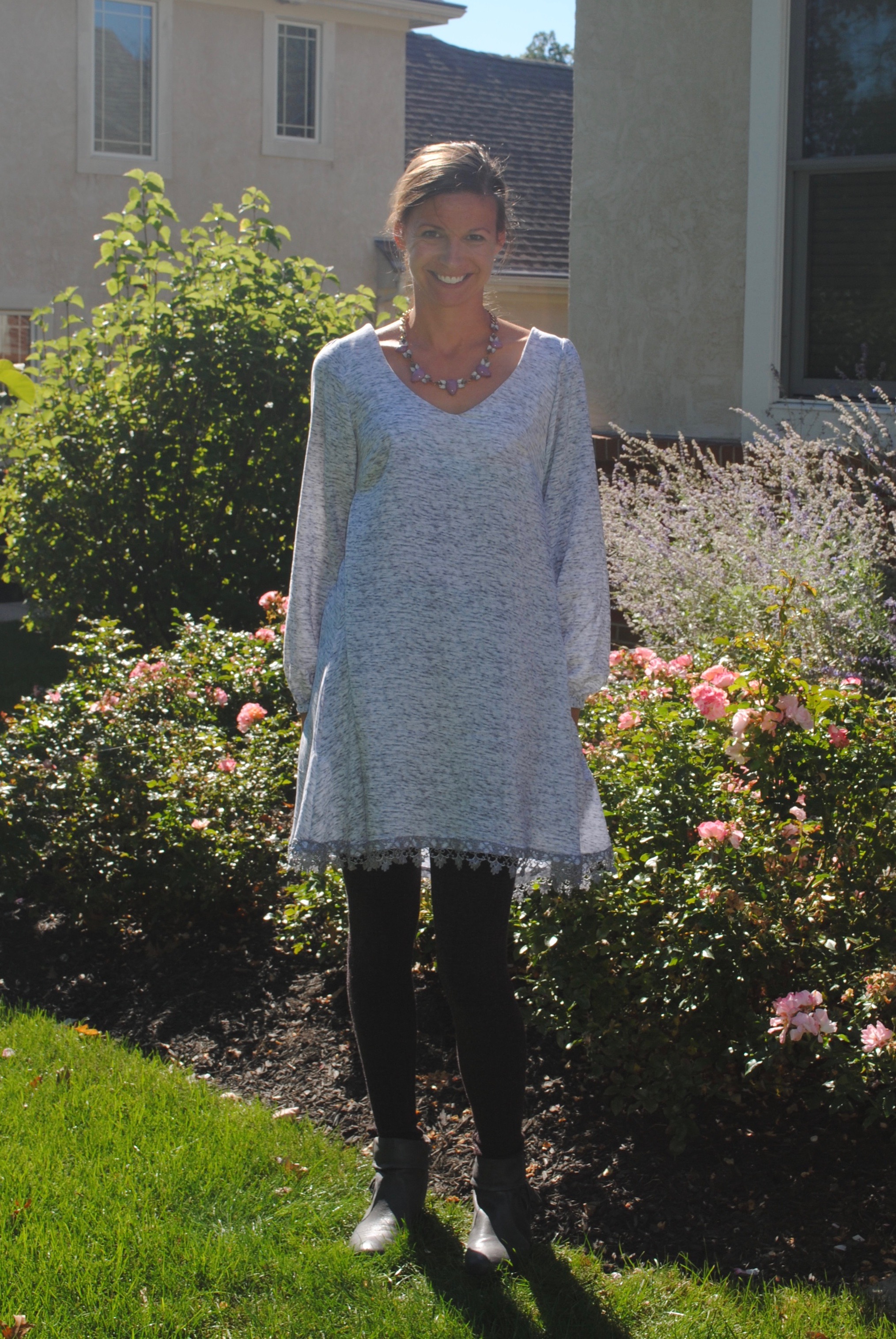 My first style includes some purple sparkly sweater knit leggings and some grey suede ankle booties. This look is a step up from my every day-running the kids around look, but still fairly casual. I threw on a sparkly necklace with it to highlight the pretty shape of the neckline!