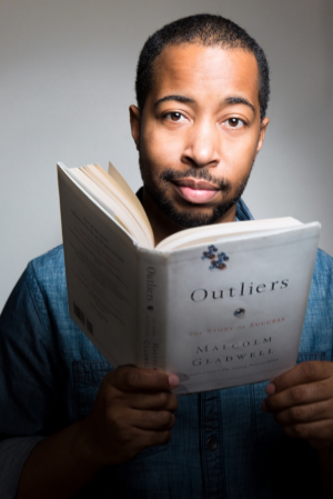 He reads. He writes. He also smiles.