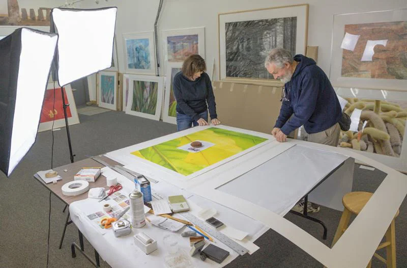 Friends Eleanor Normille and Carl Schwab assembling a matt.