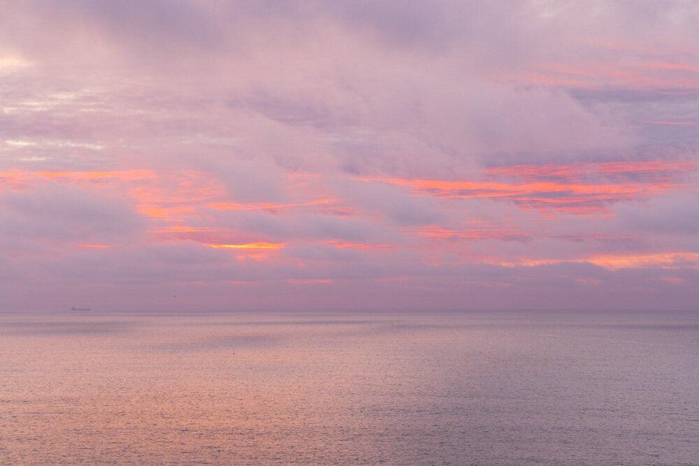 Striped Sunset Behind Clouds 2021. Canon EOS R5In the hope of bringing my mind and heart back from the threats to our country, my evening walks have again brought me a visual experience I worked to record. Although not up to the magic of what I saw,…