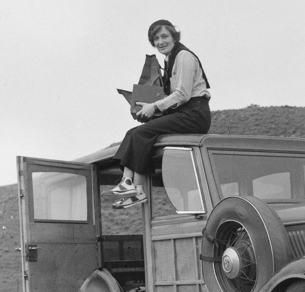 Dorothea Lange on her Ford with her Graflex D. Feb. 1936. FSA.