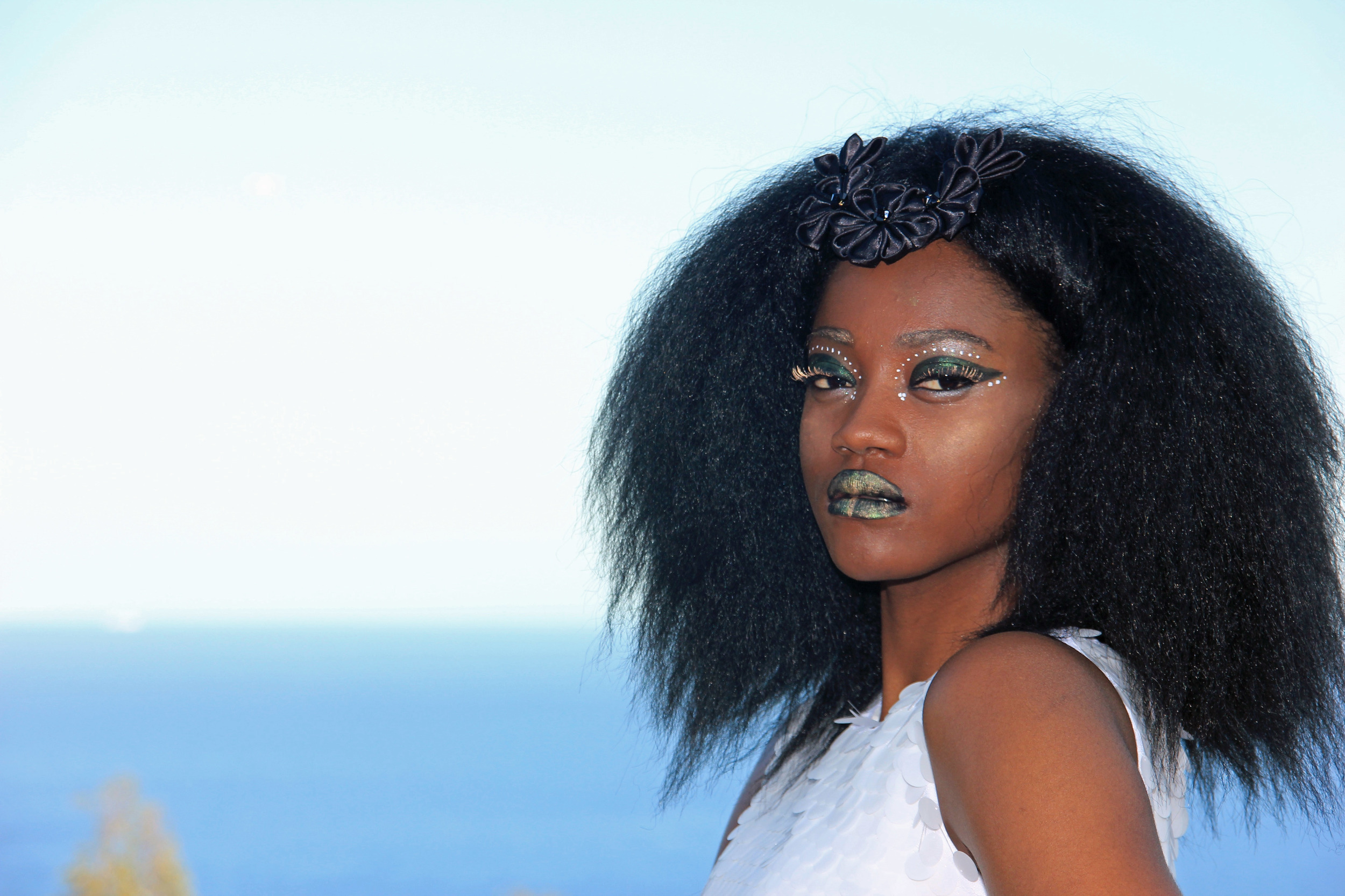 Dark skinned model in front of the beach commercial portrait