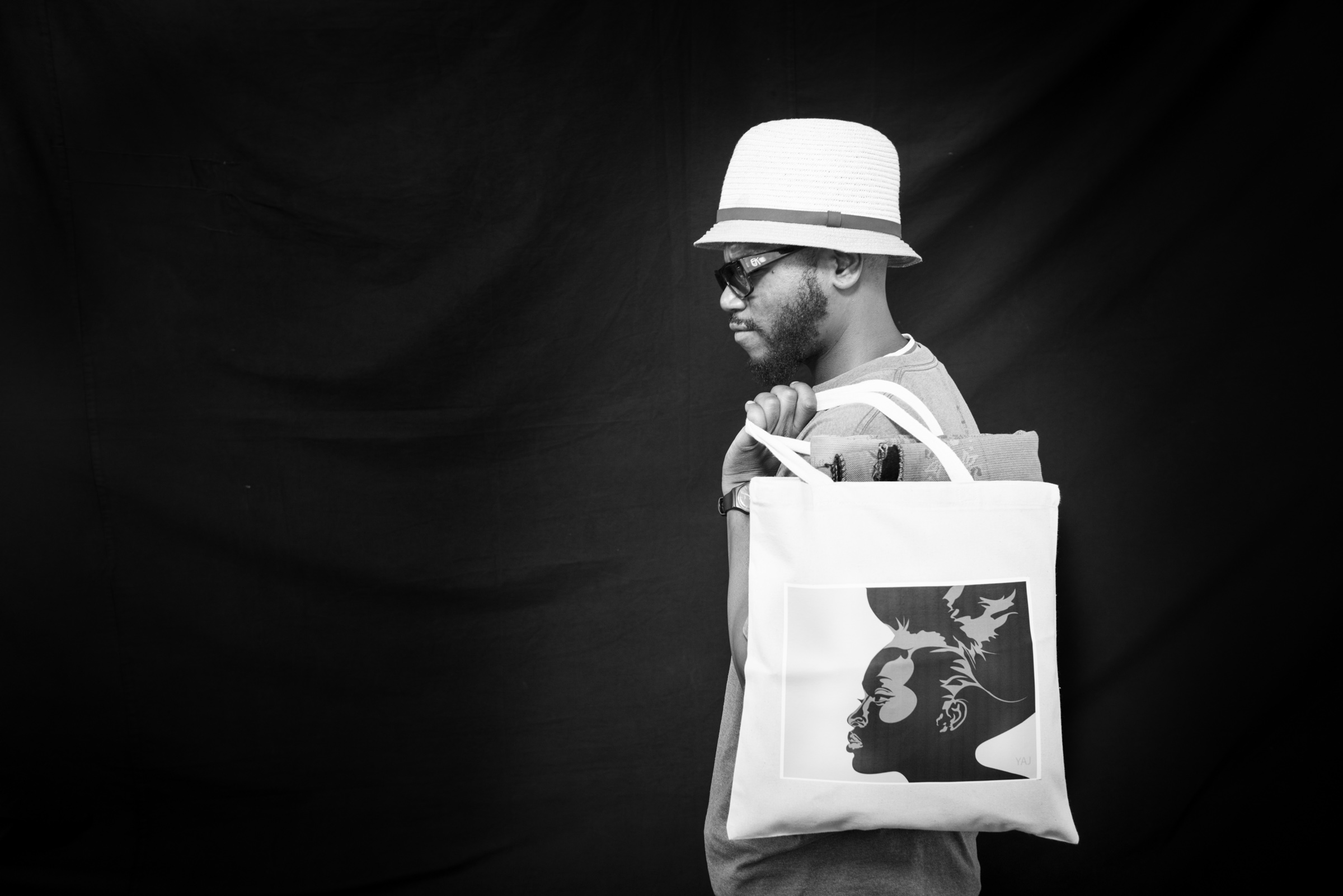 Man with Canvas Bag photographed on black background