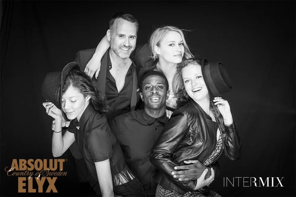 Black and White Portrait of Group of Friends on Black Background