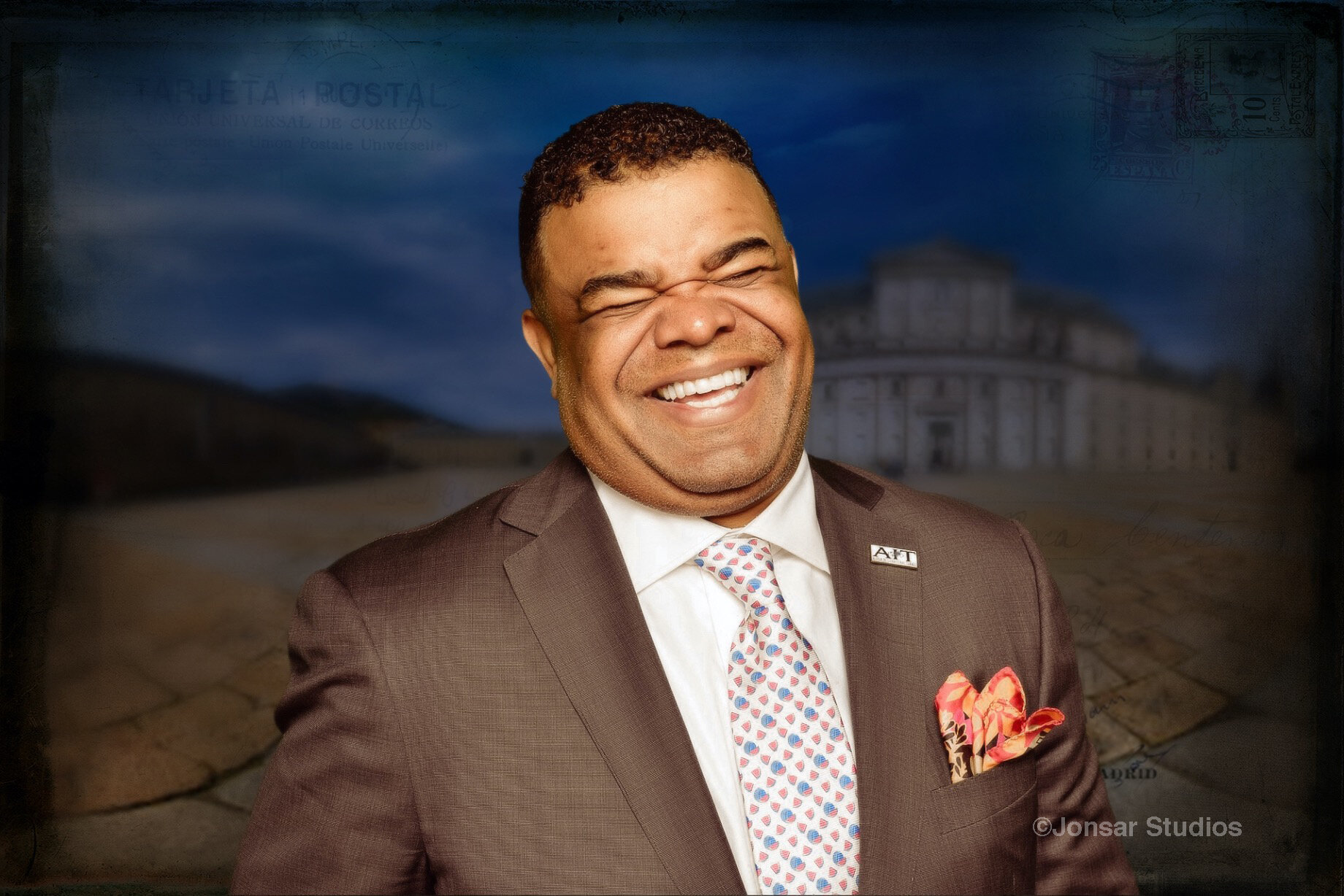 Smiling man in suit on composited background