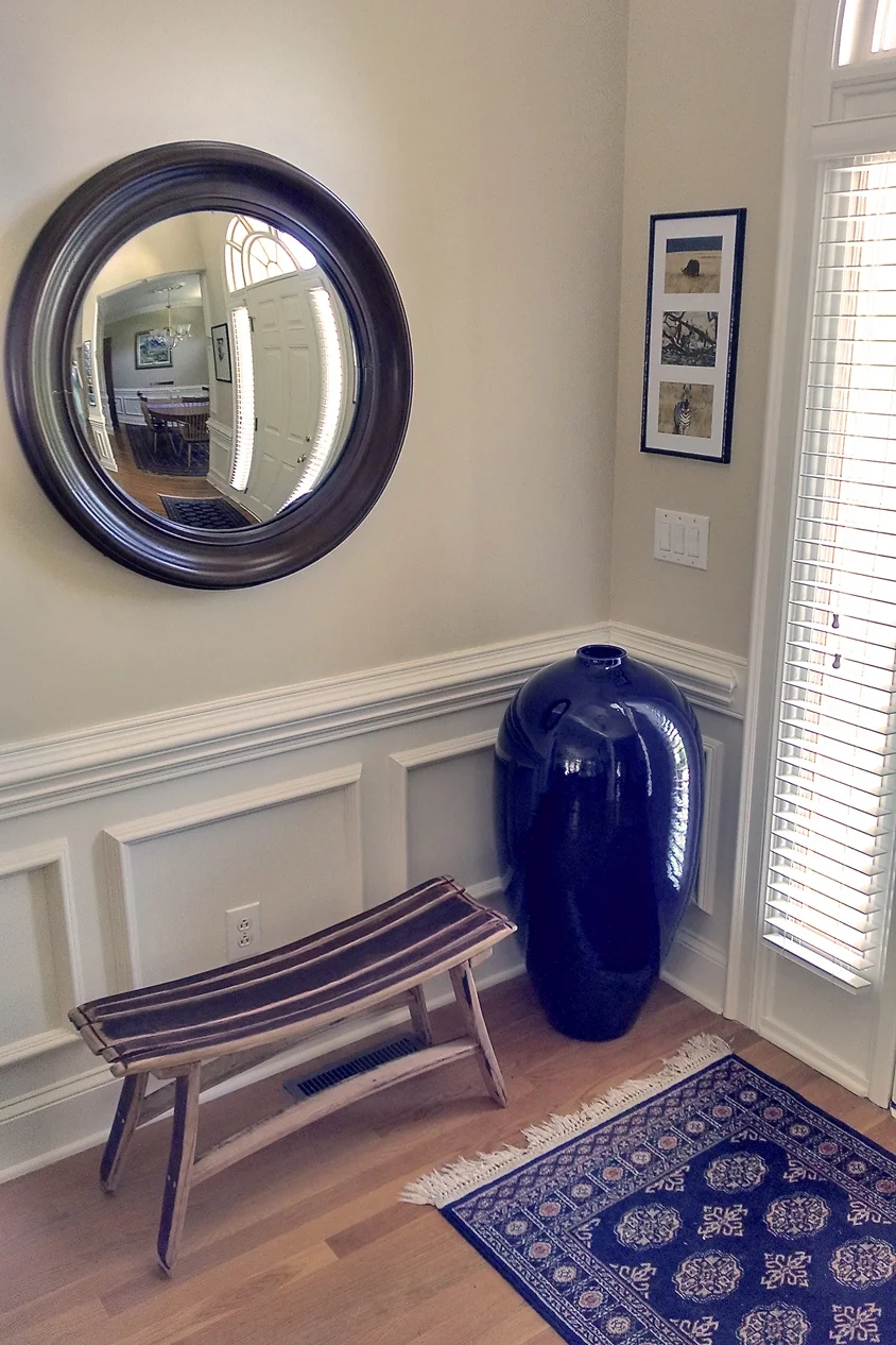 A large Cobalt Blue vase is the perfect centerpiece in this entryway.
