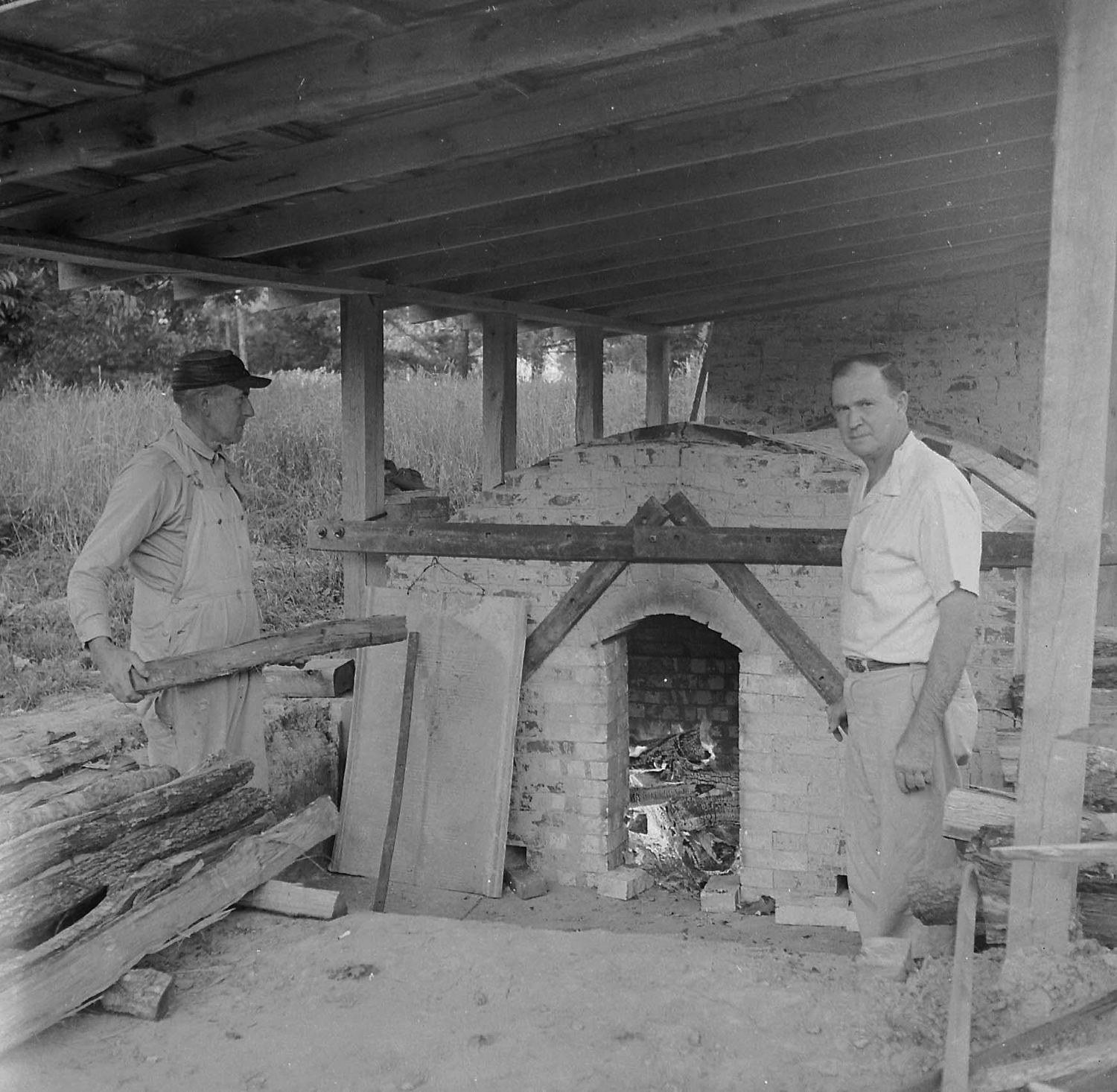 Ben Owen and Boyce Yow Firing Groundhog Kiln 1959.jpg