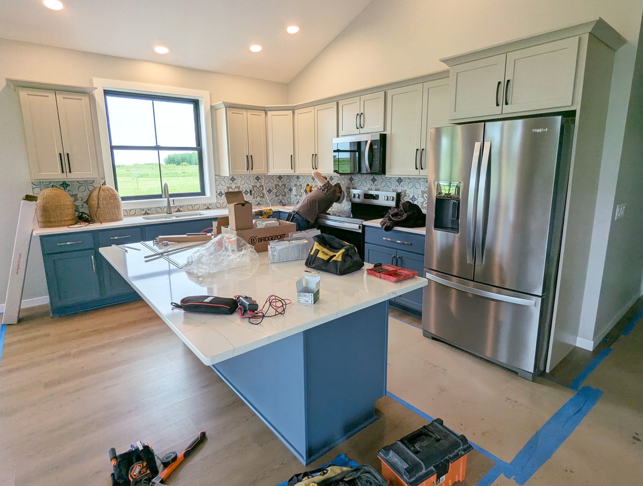 The electricians are just wrapping up the lighting in the kitchen and with a few more finishing touches, this Crystal Lake home will be complete!