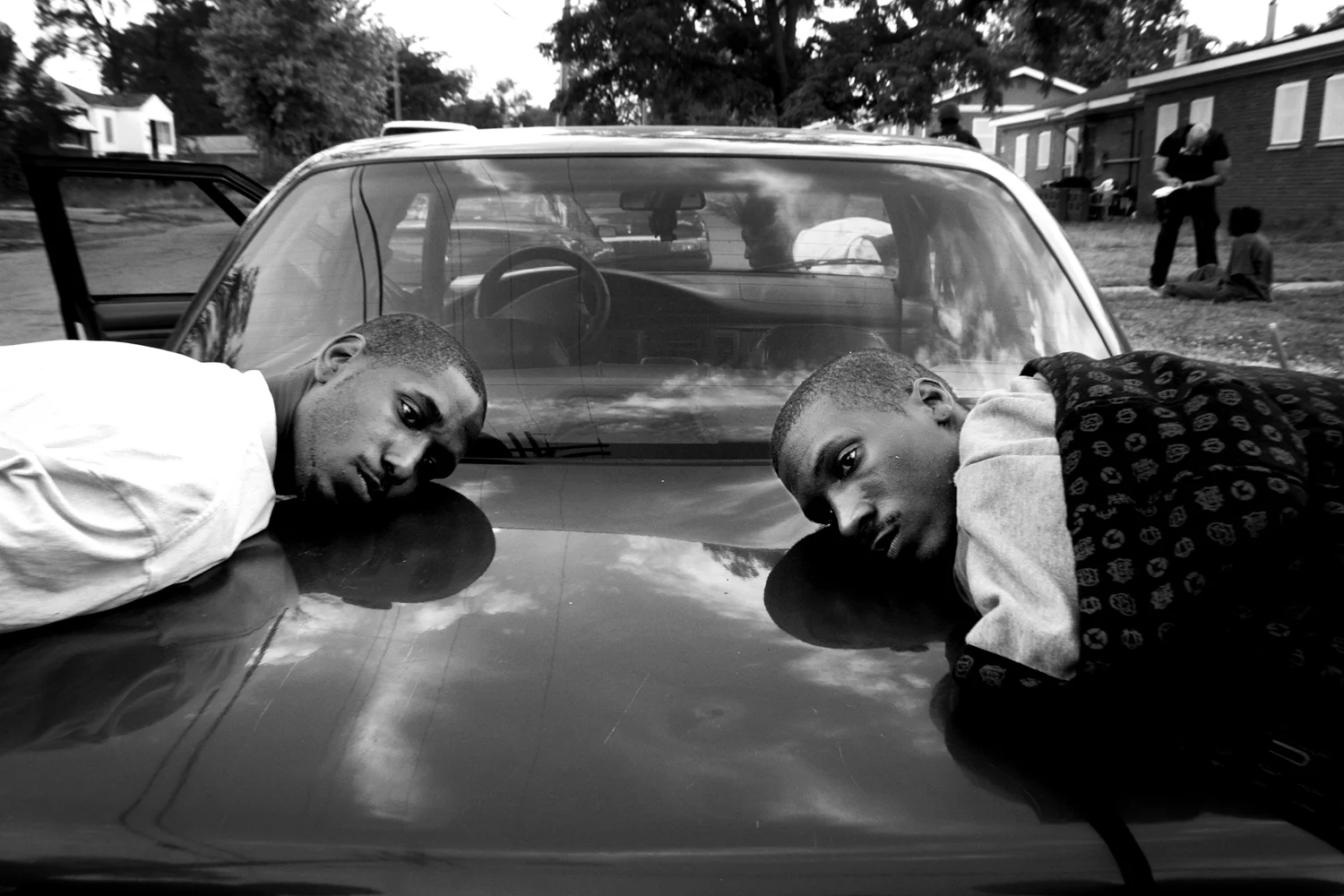  The sons of Barbara Barker wait to be taken to jail after selling crack in front of their mother's house on Polk Street in Gary, Indiana. 