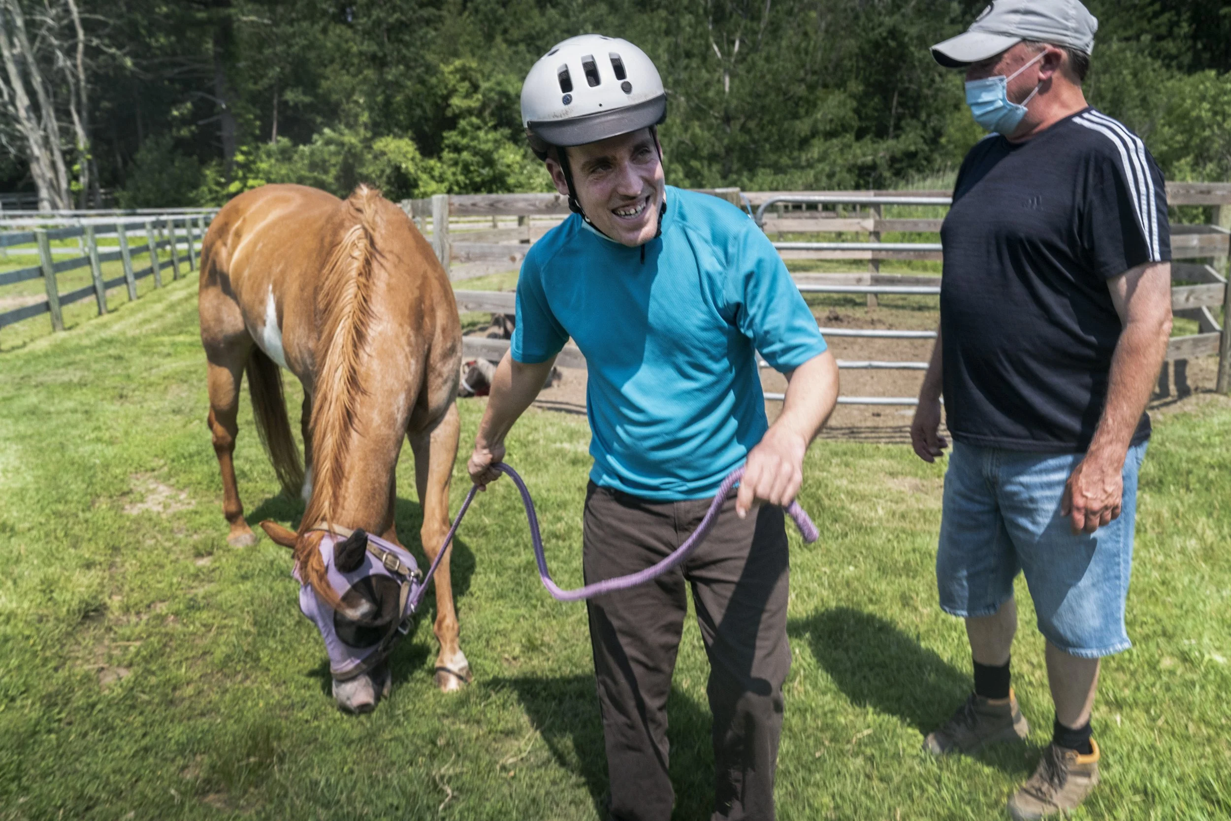 Andy Tranfaglia leads Clover back to barn as trainer Ray Hackett,  watches closely. 