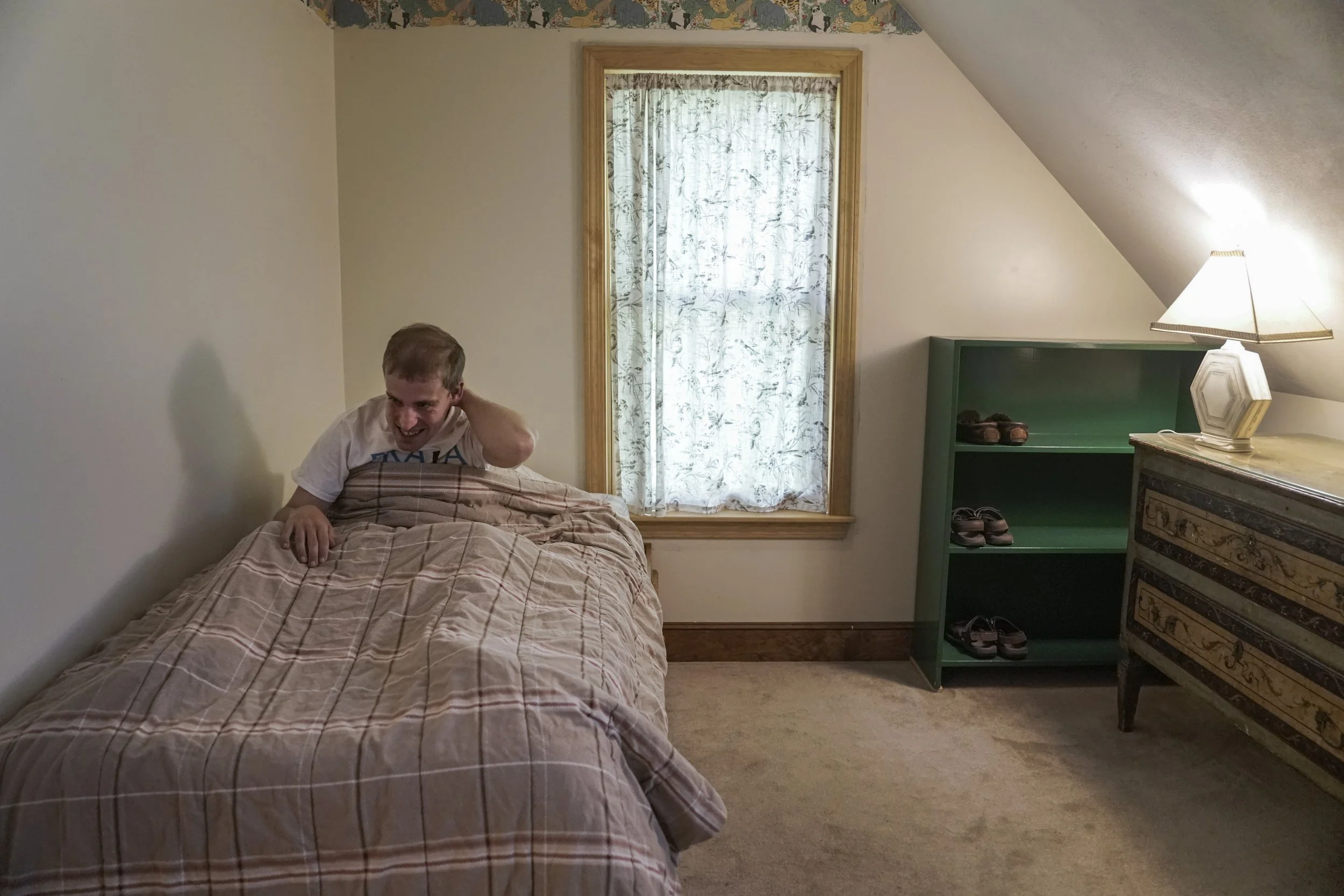  Just after 6:30 p.m., Andy Tranfaglia says good night before going to bed June 21. According to his mother, Katie Clapp, Andy prefers to have very little in his room. She says it took years of working with him for Andy to be OK with leaving his shoe