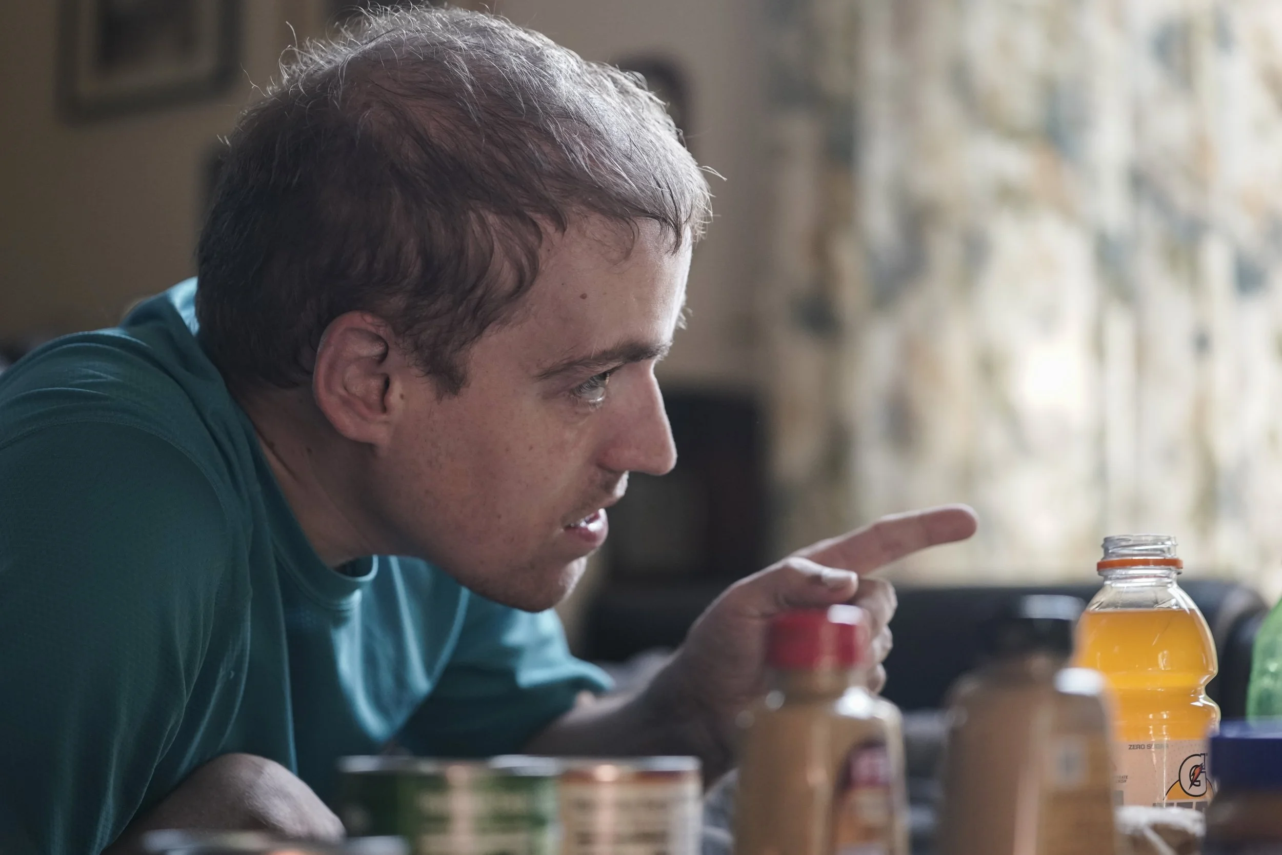  Andy Tranfaglia eats dinner on his favorite couch while watching Scooby-Doo and playing a Sesame Street game on his iPad. 