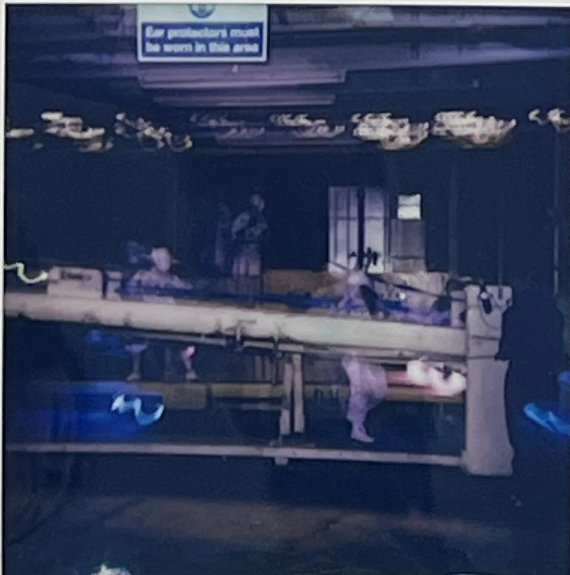 A decommissioned factory machine becomes a display for gathered objects and ritual offerings during Ghost in the Machine.