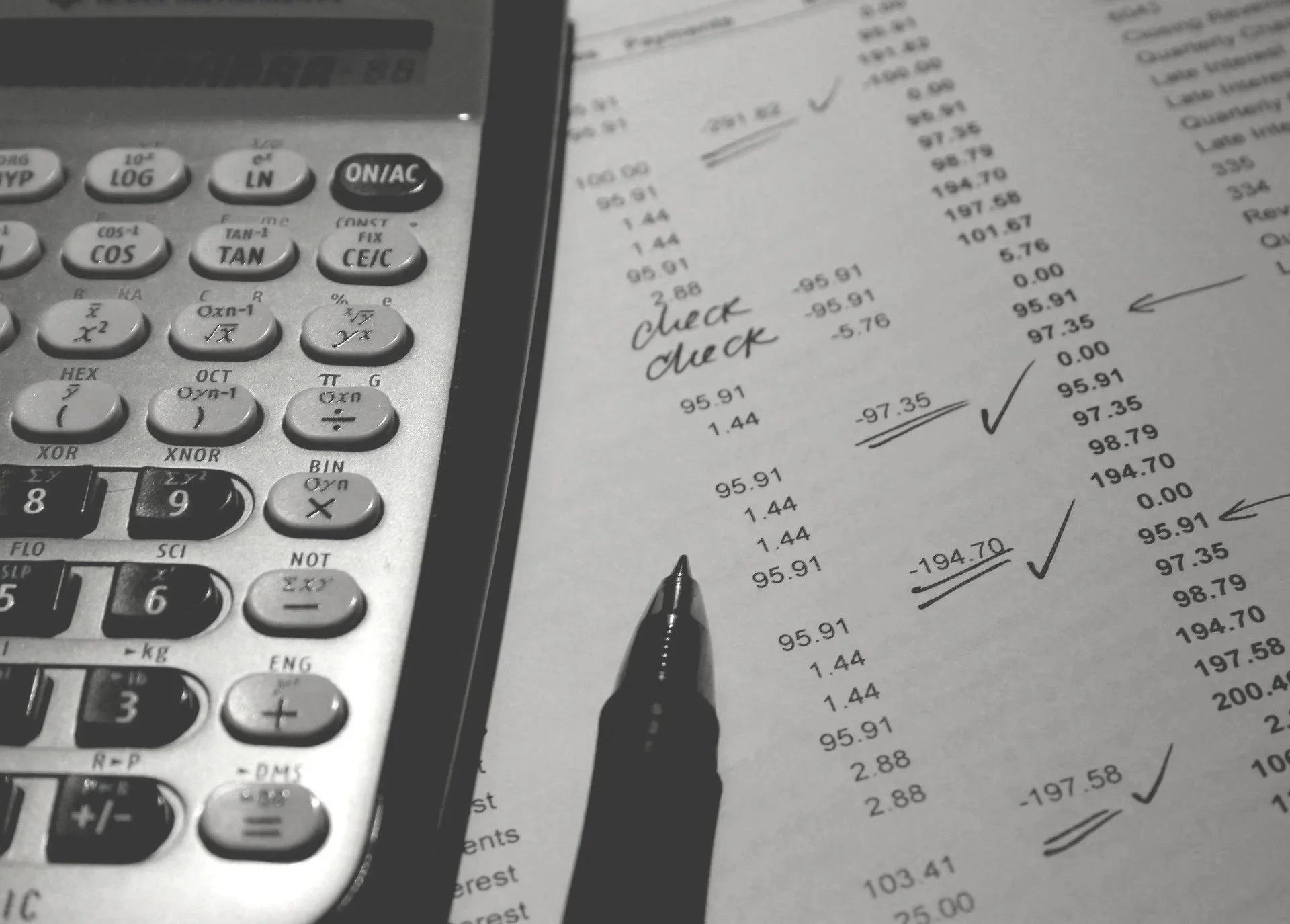 accounting-the old fashioned way with paper and calculator.jpg