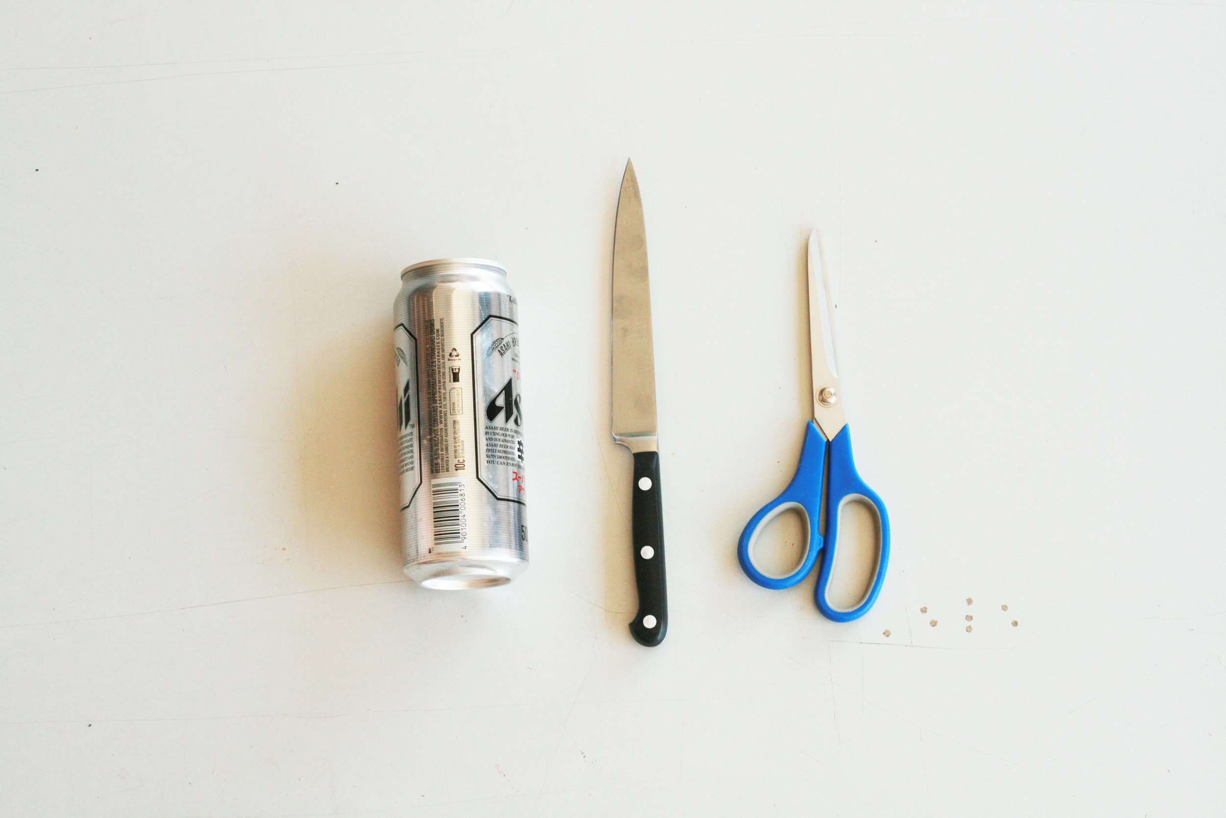 You will need 1 x empty beer or soft drink can, 1 x knife and 1 x pair of scissors