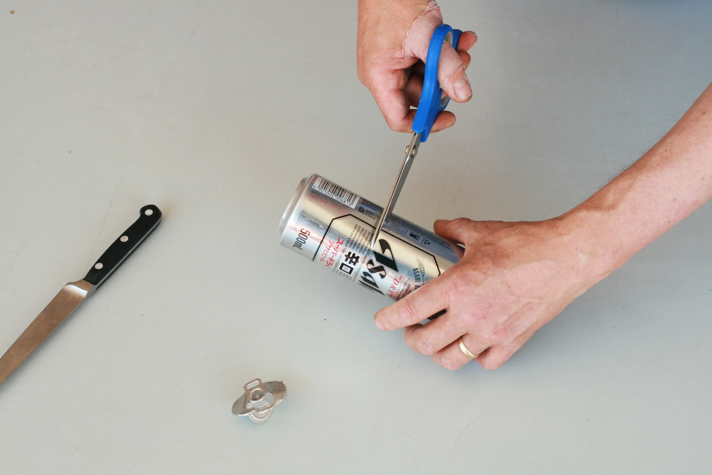 Cut the can roughly in half.