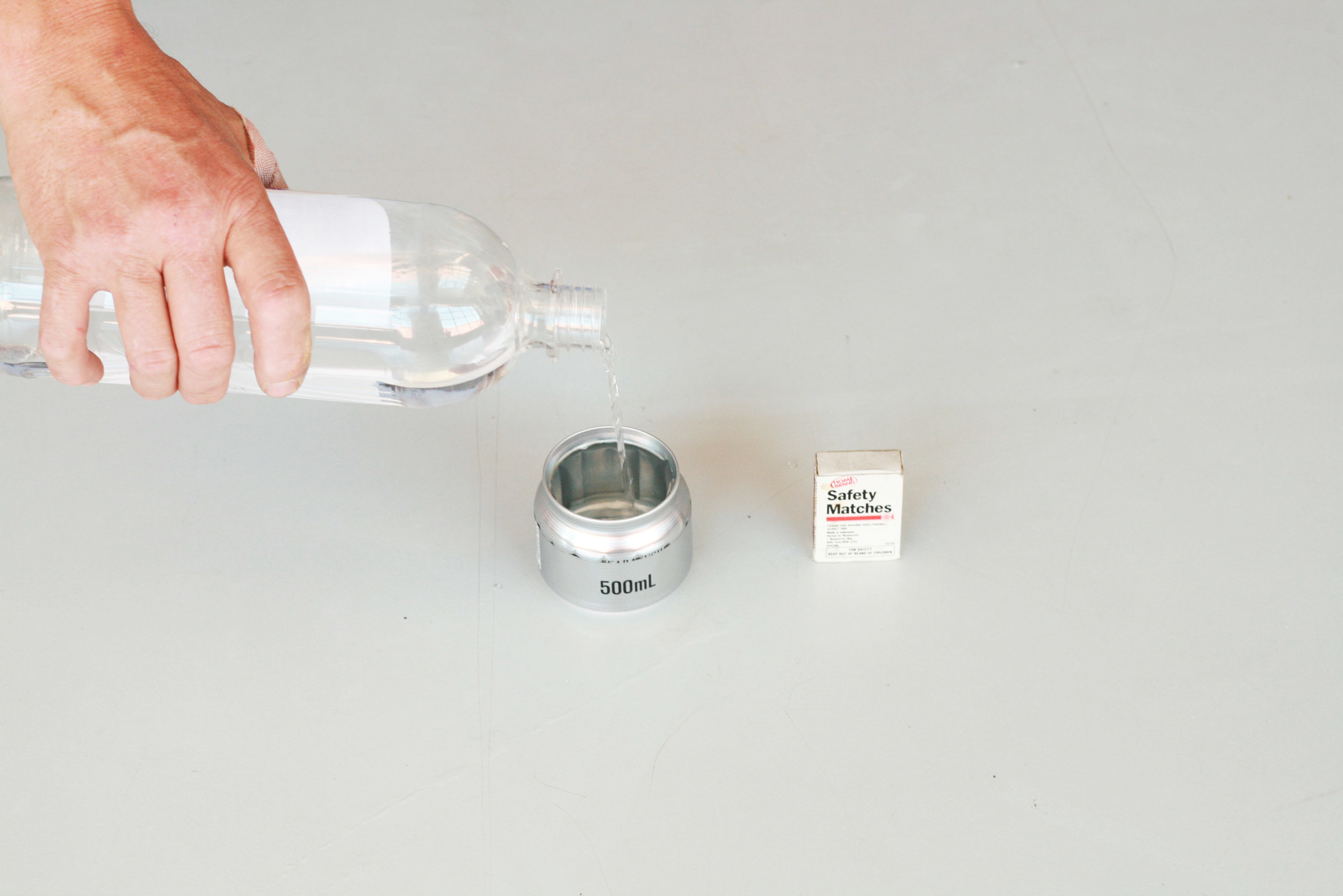 Fill the can with fuel so it just covers the bottom edge of the stove top vents.