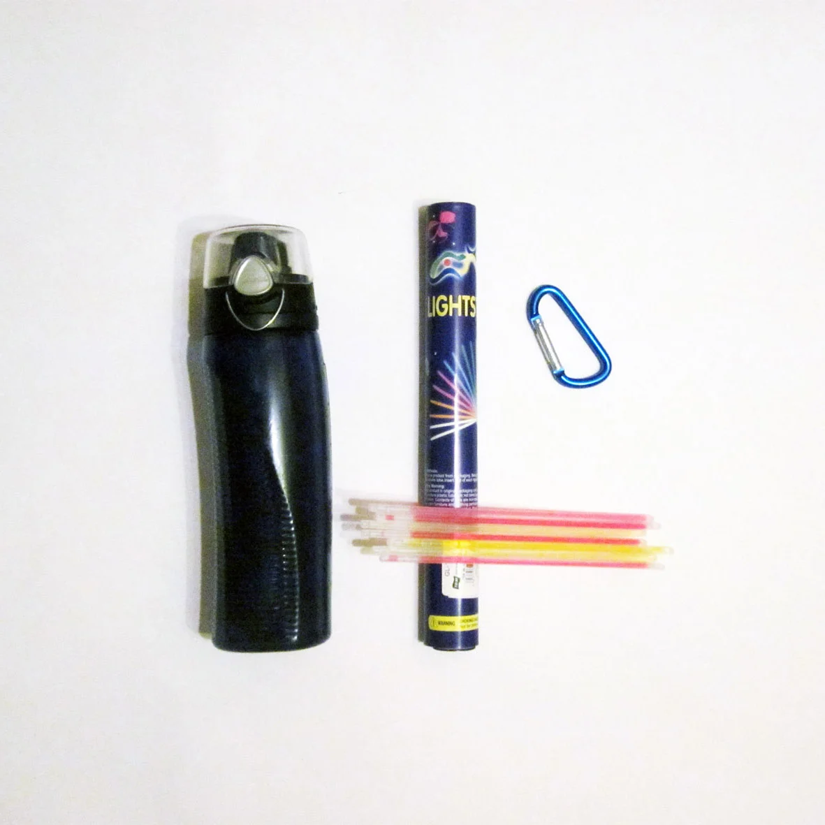 You will need 1x coloured & see through drink bottle, heaps of glow sticks and a carribeena or clip