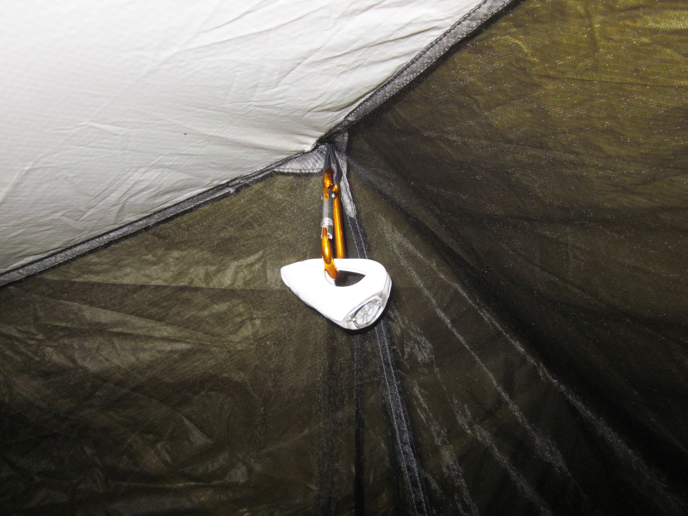 clip the caribeena to any part of the tent roof that will take it. And turn on the light.
