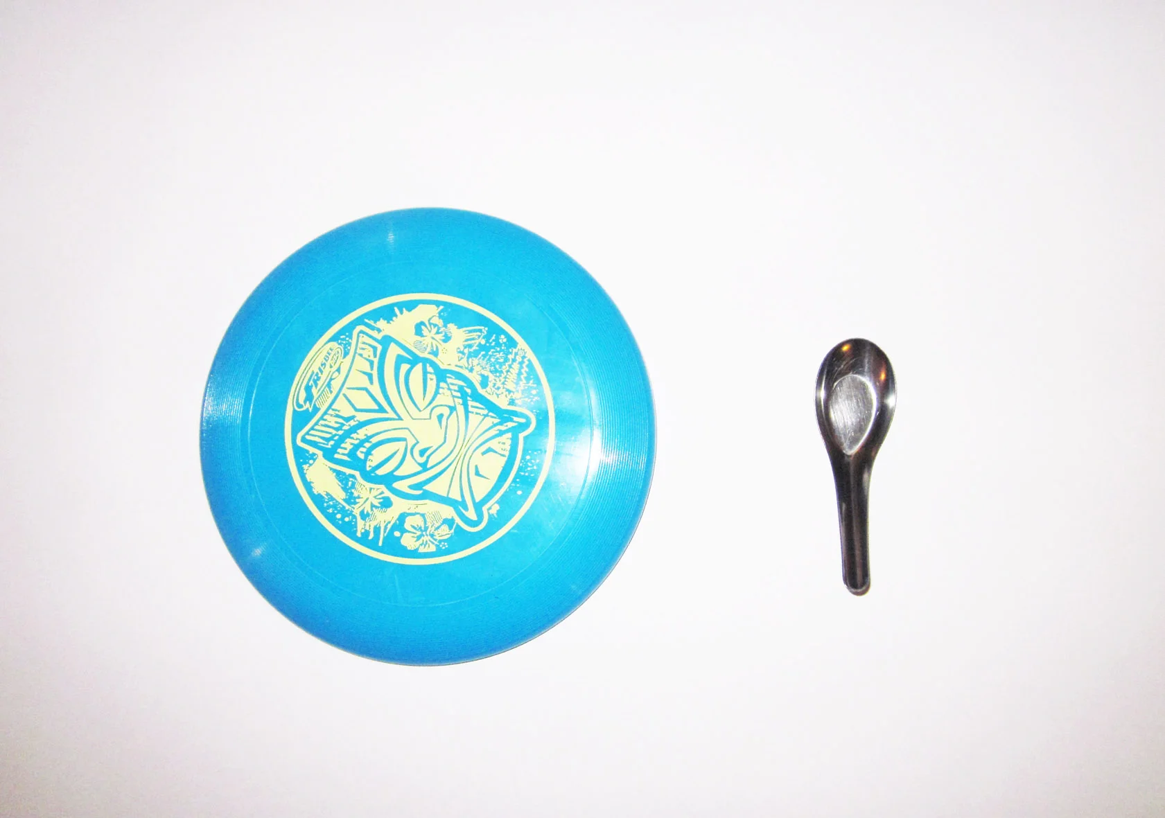 You need a cheap kids frisbee and an chinese soup spoon.