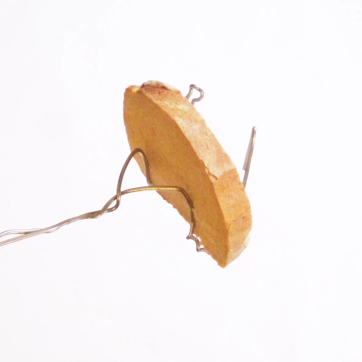 With a bit of playing aroud form a U shape with the 2 ends. There are a thousand different ways to do it.