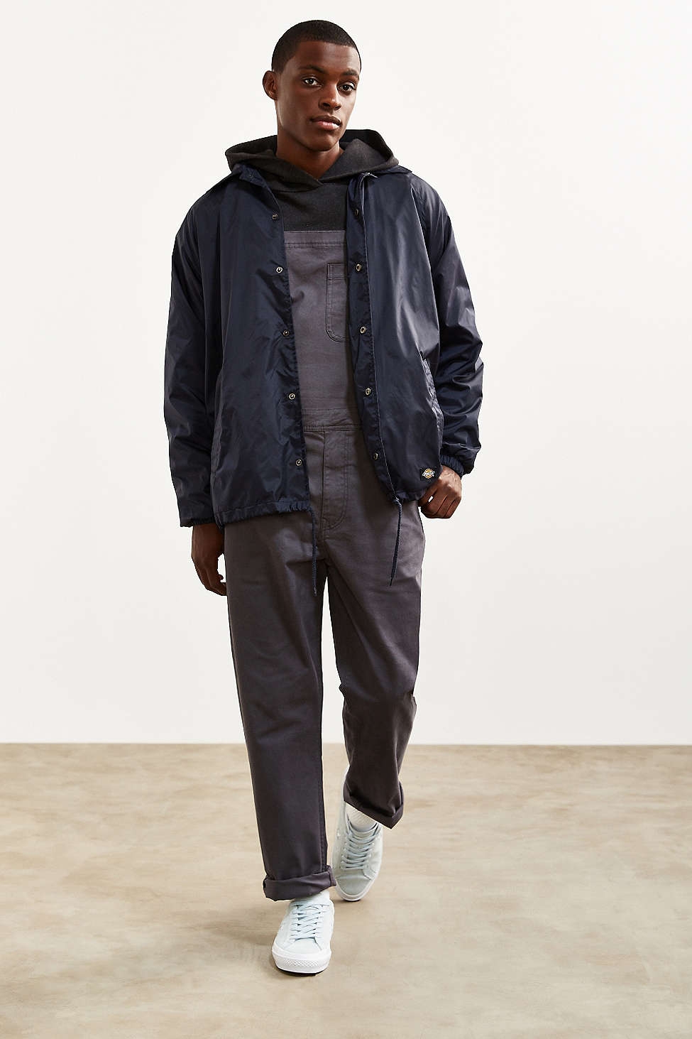 concrete floor and white, sliding set wall for UO Men's