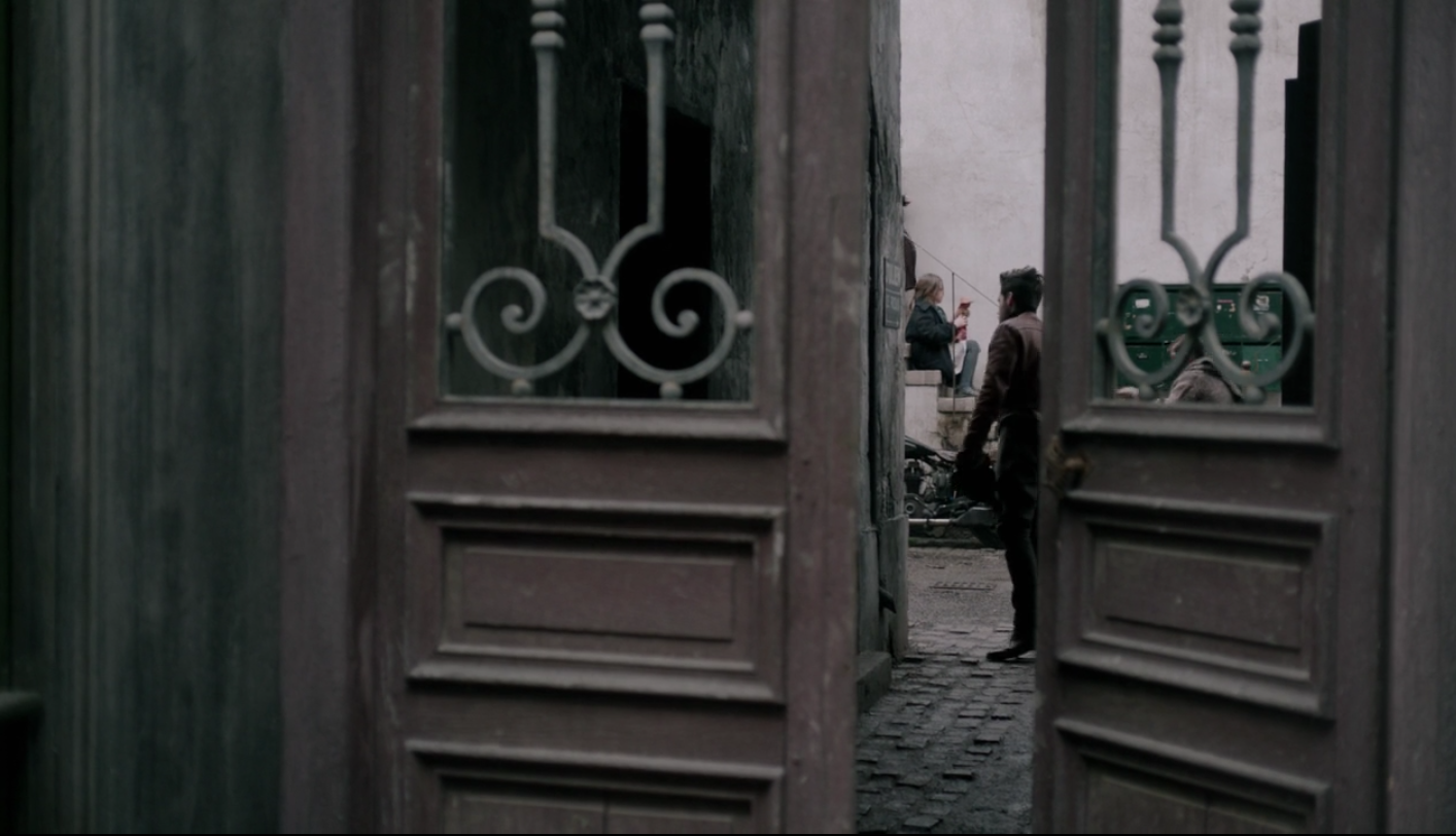 a Parisian courtyard entry from the Amazon Prime show, The Collection (Do you love 1950’s fashion? Watch it!)
