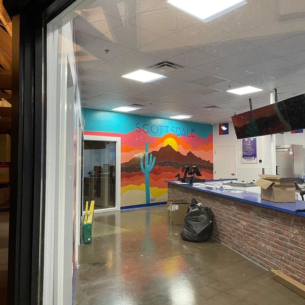  mural as seen through the shop window 