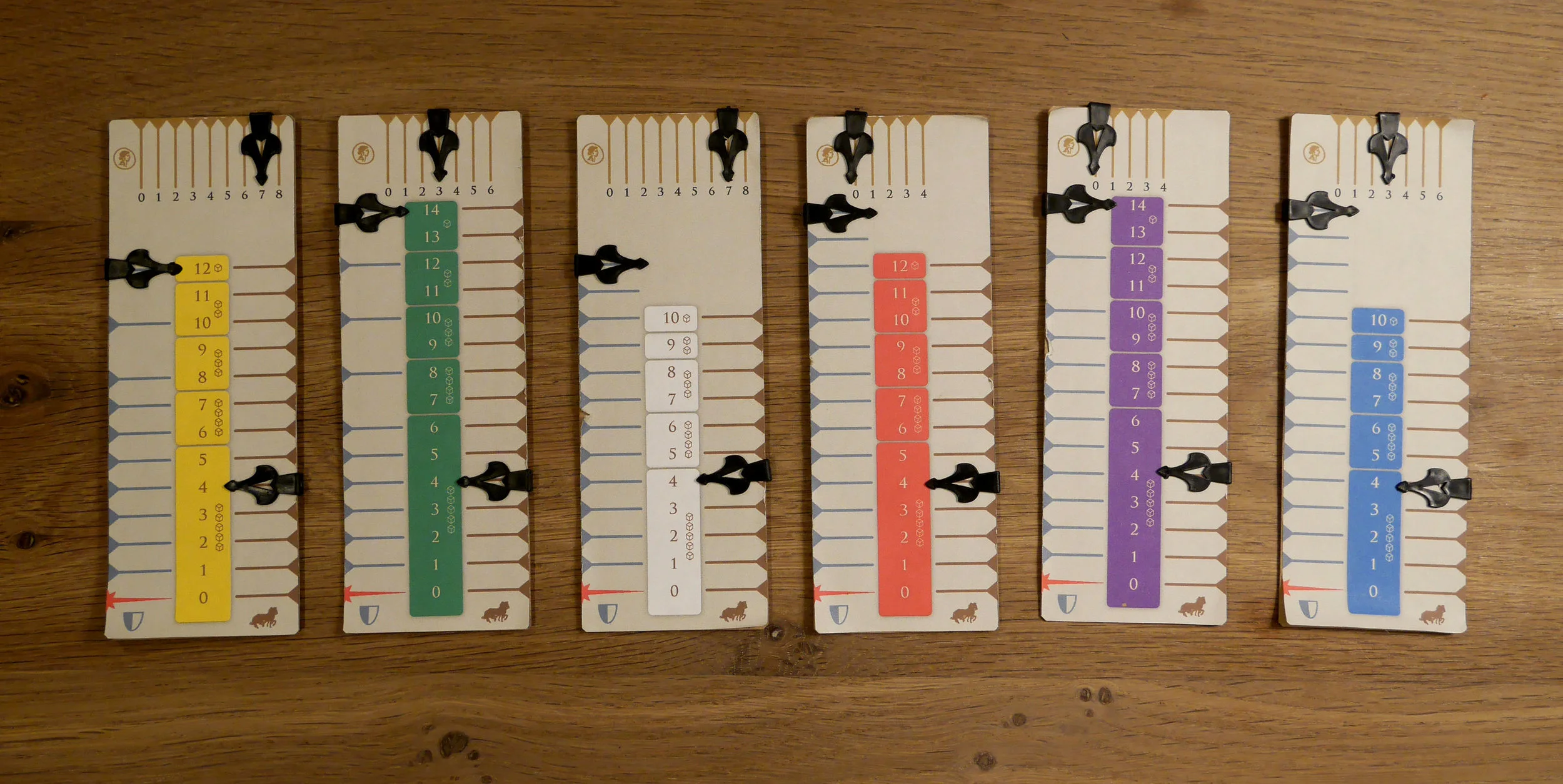 Here are the reverse sides of the chariot boards showing the six different configurations. Chariots are either sturdy, normal, or flimsy; horses are either speedy, normal, or slow; and charioteers are either lucky, normal, or unlucky.