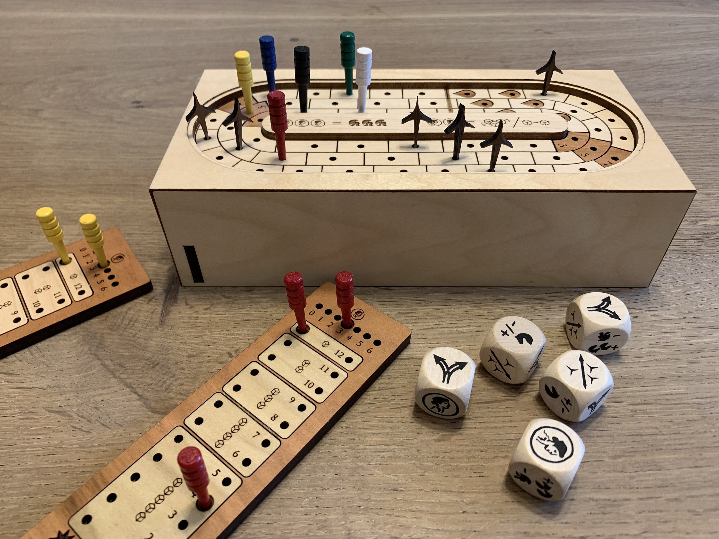 Four wooden board games with plastic pegs suitable for 3 yrs and upwards 