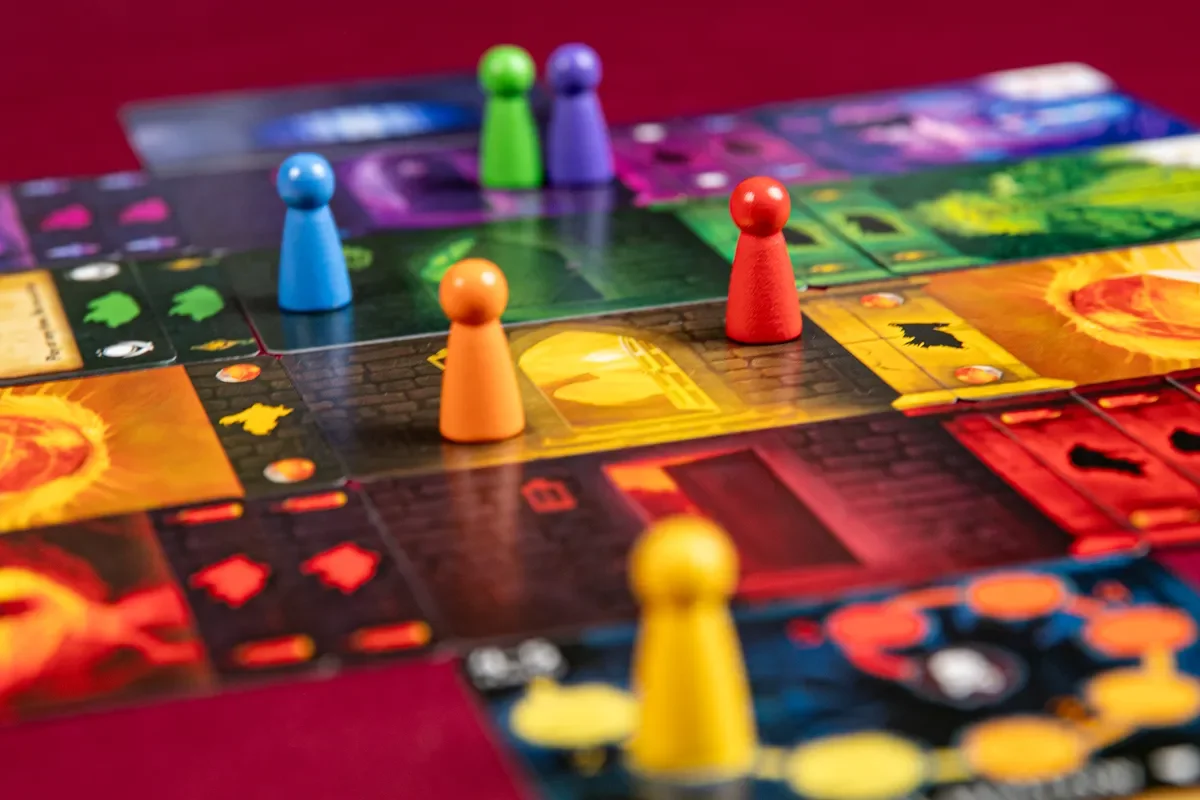 A Four Doors game in progress. Pawns sit on the various doors while shadows threaten each level.