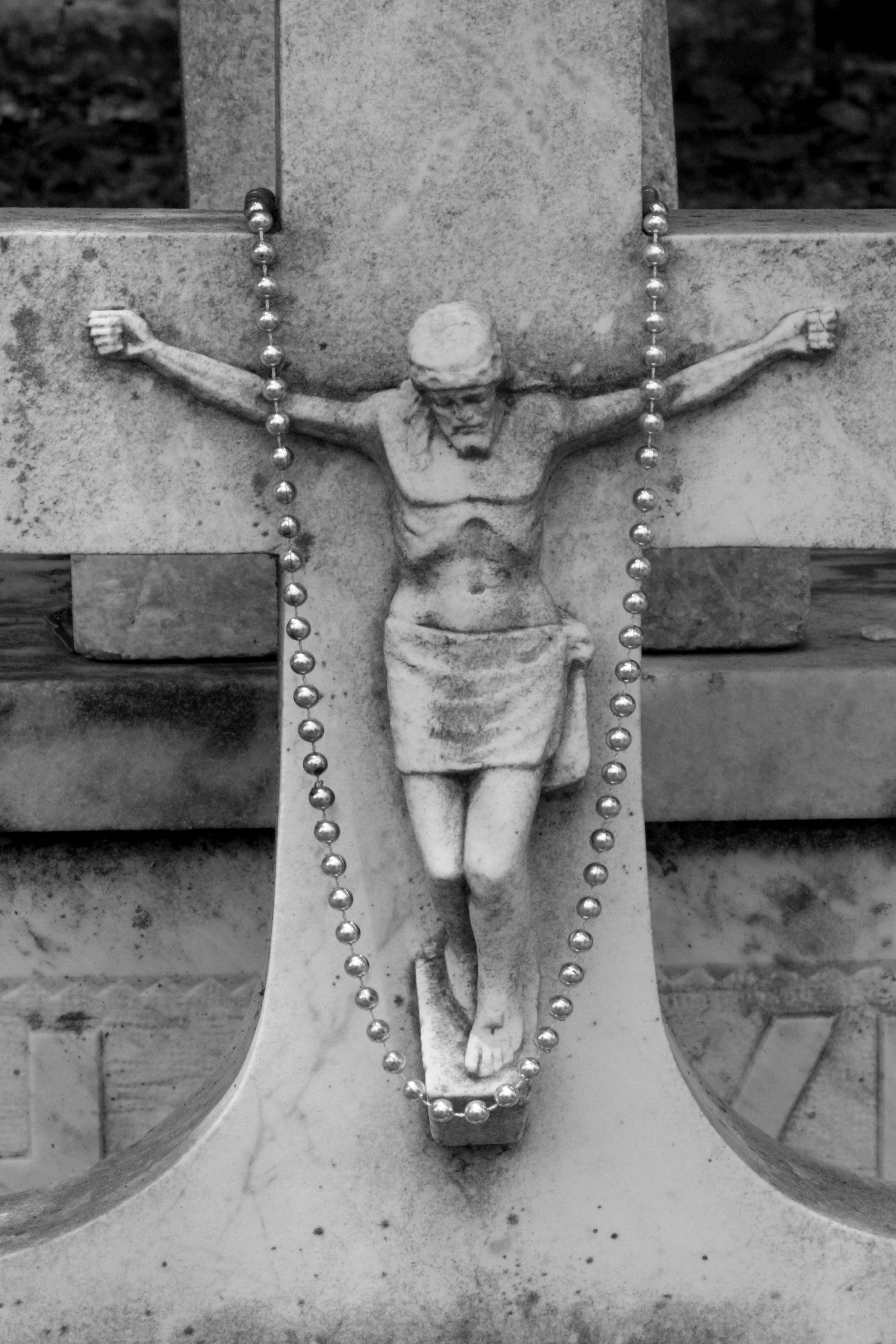 jesus and mardi gras beads cemetery detail, new orleans, louisiana, usa