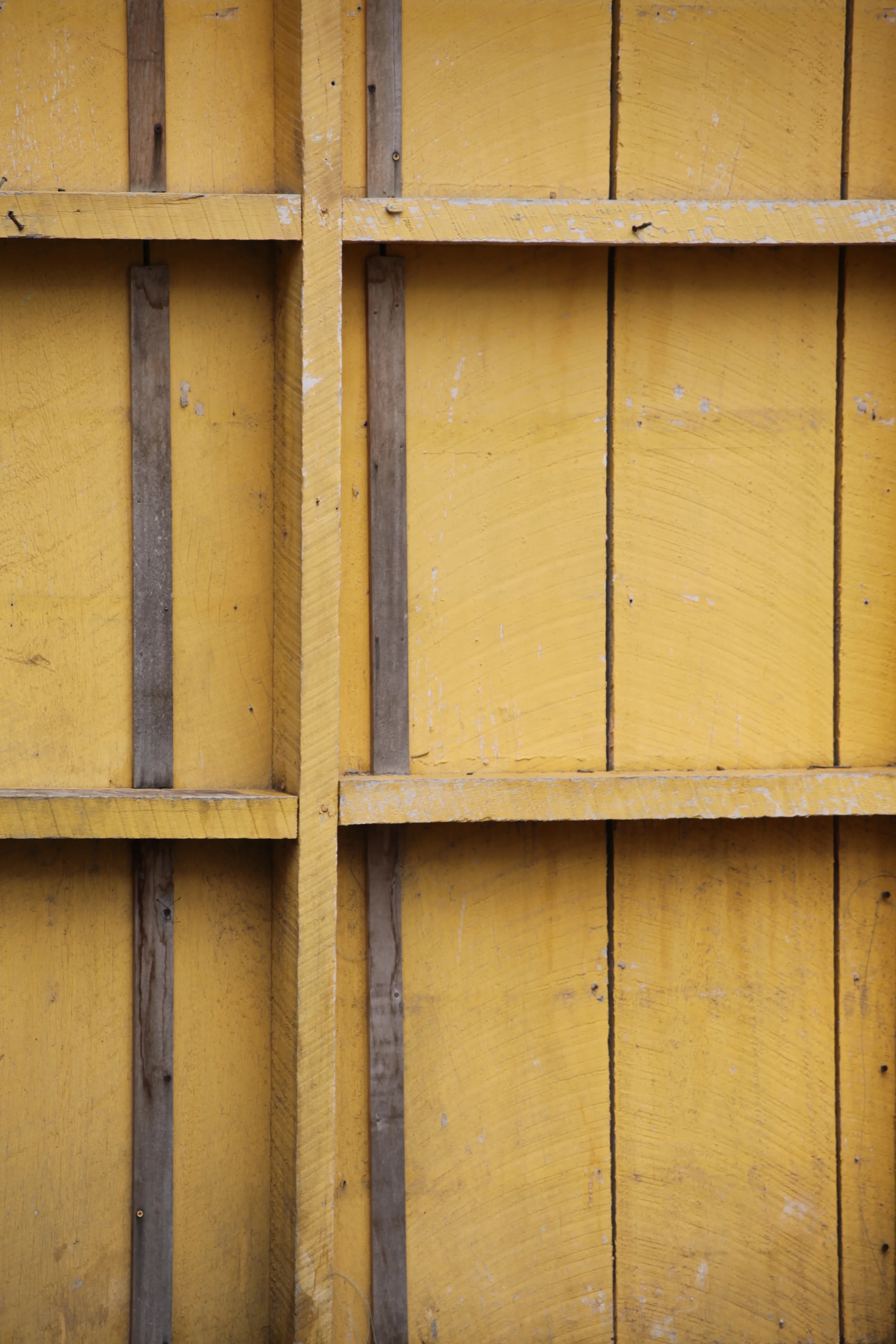 yellow wall, placencia, belize