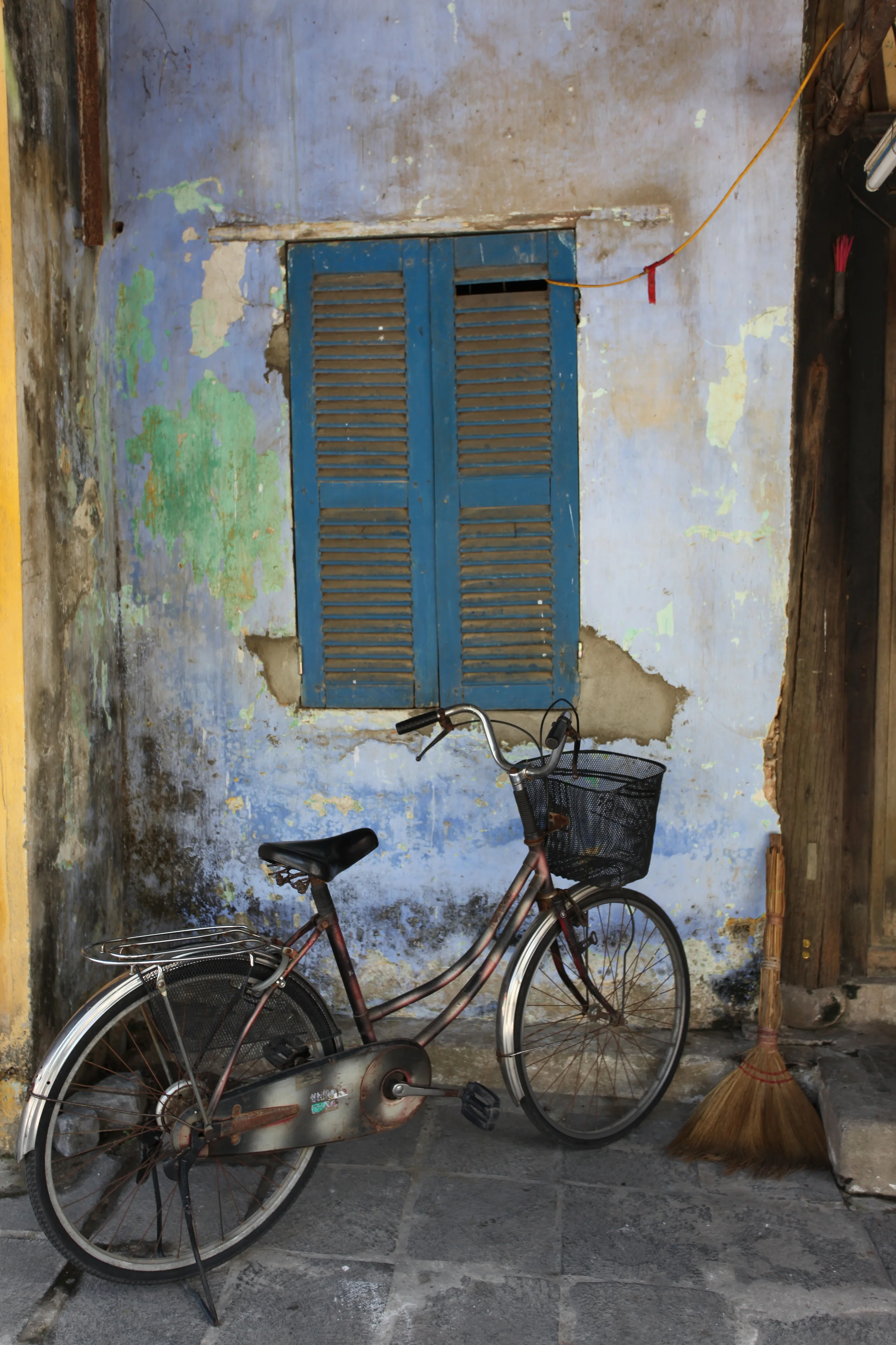 bike and broom, hoi an, vietnam