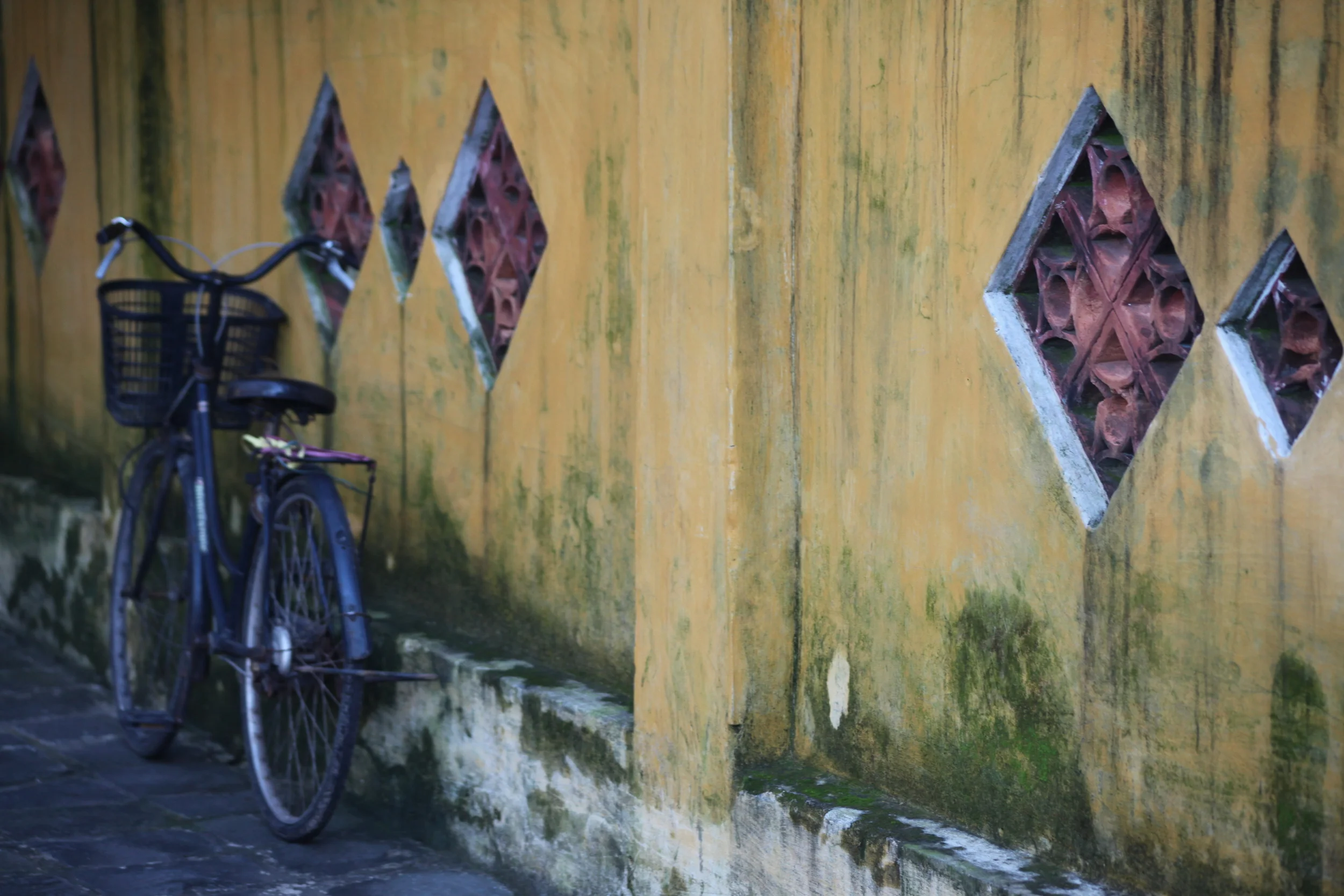 ornate yellow wall, hoi an, vietnam