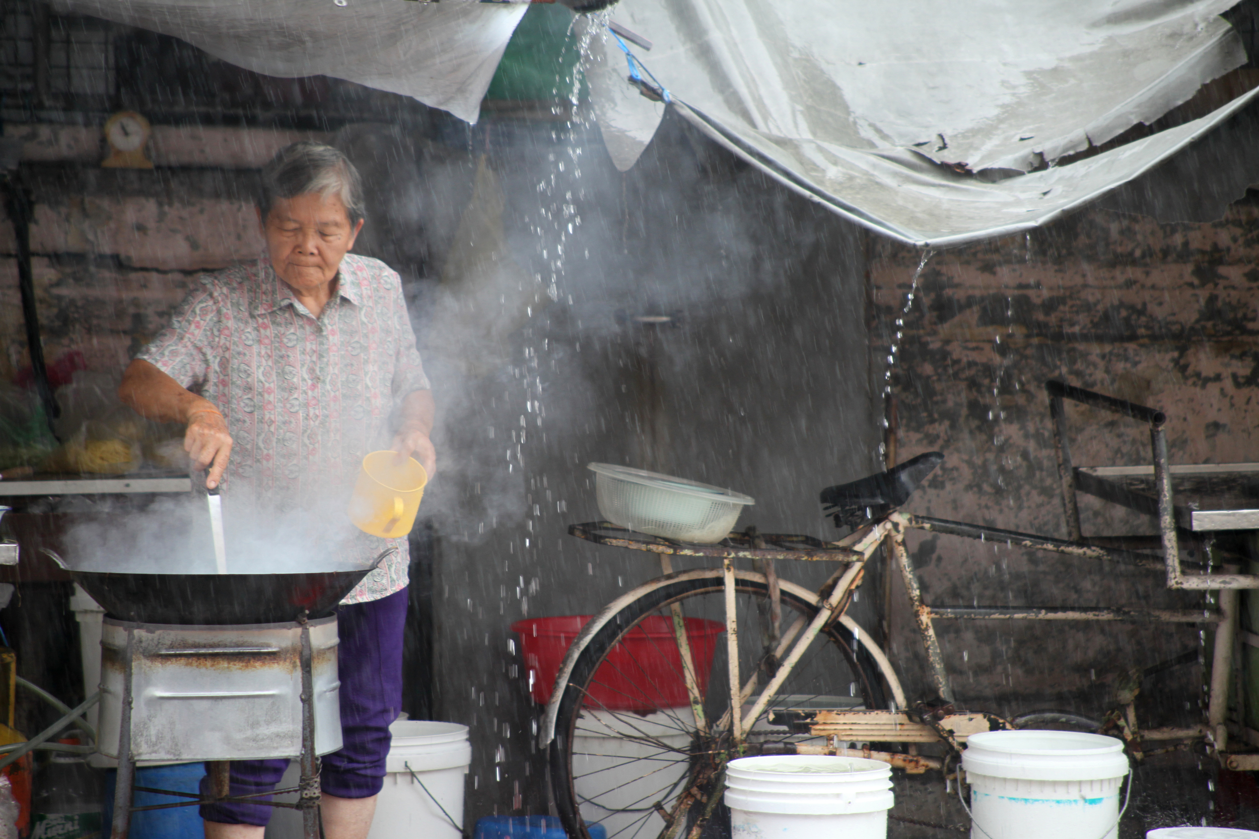 roadside cooking, rain or shine, penang, malaysia