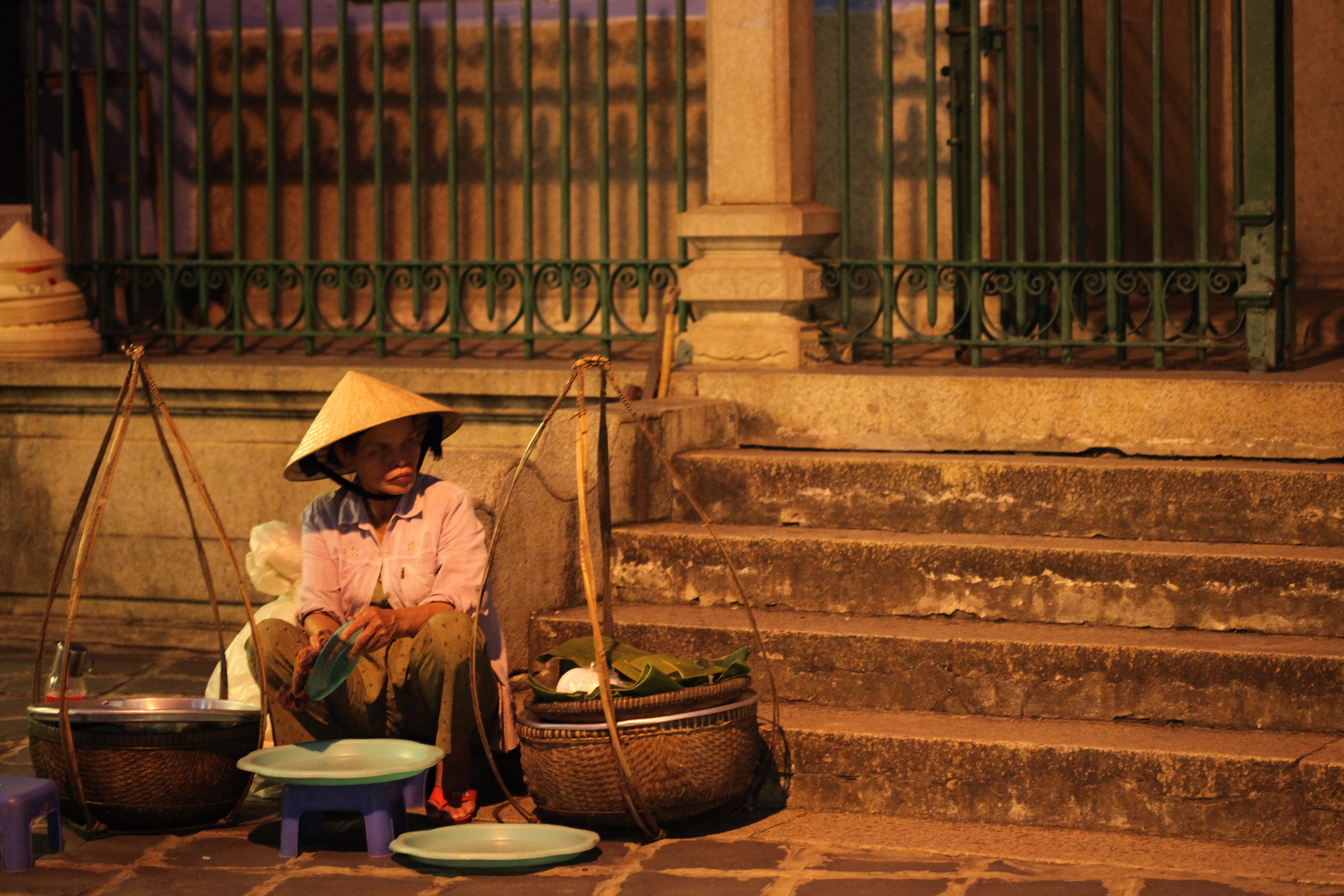 street vendor washing dishes, hoi an, vietnam