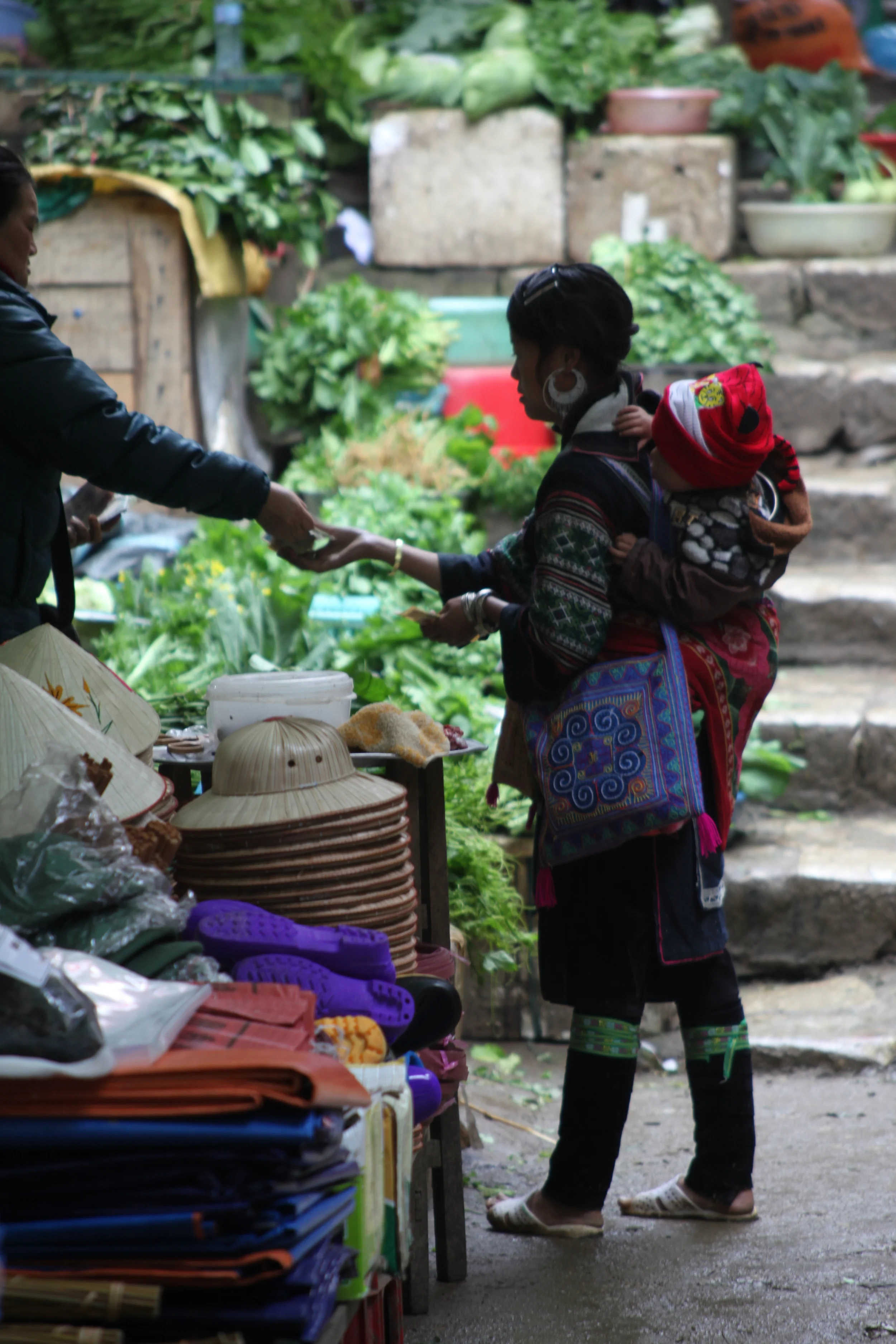 hmong mother at farmer's market, sapa, vietnam