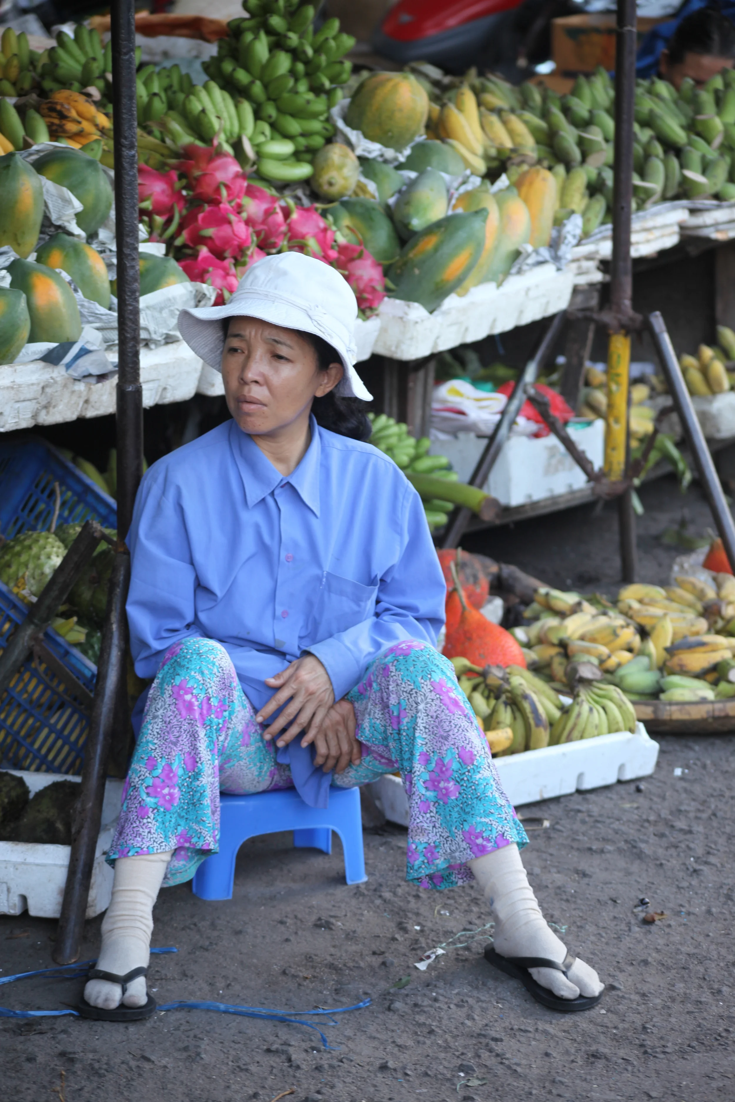 fruit vendor with hat, nha trang, vietnam