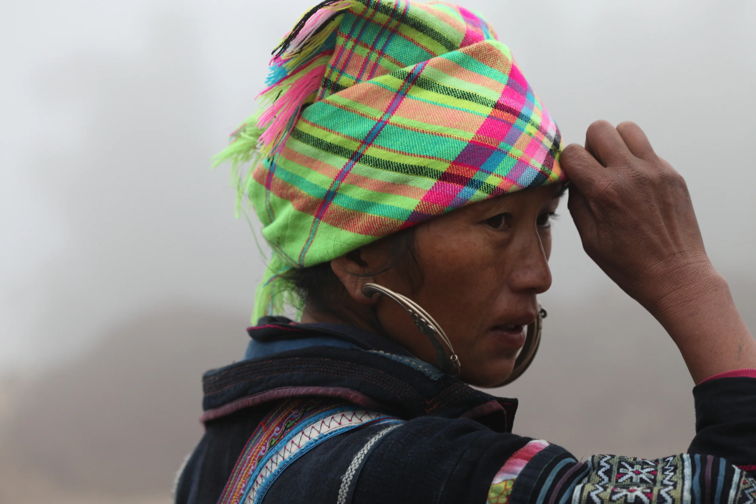 hmong woman with large earrings, sapa, vietnam