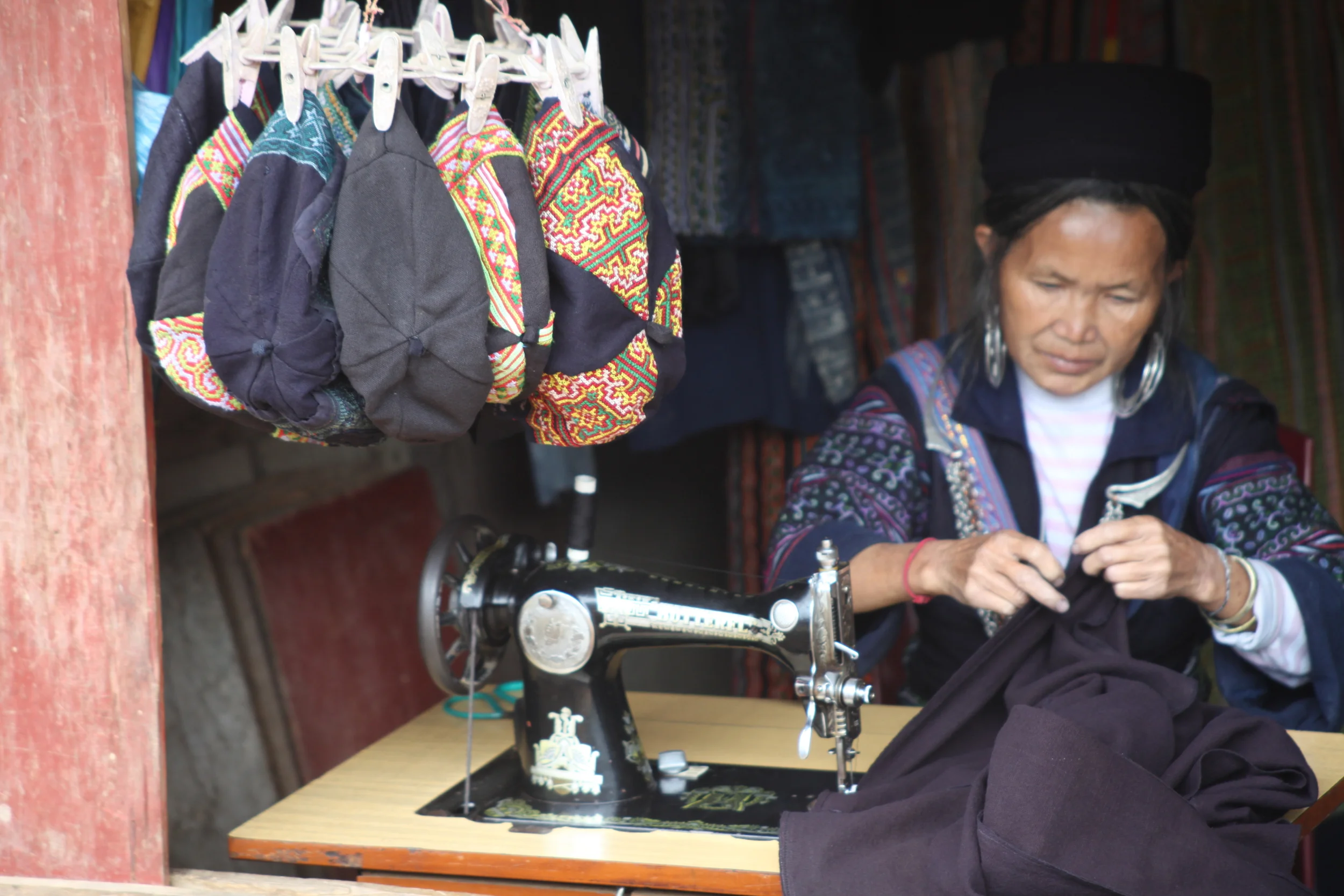 hmong woman sewing, sapa, vietnam