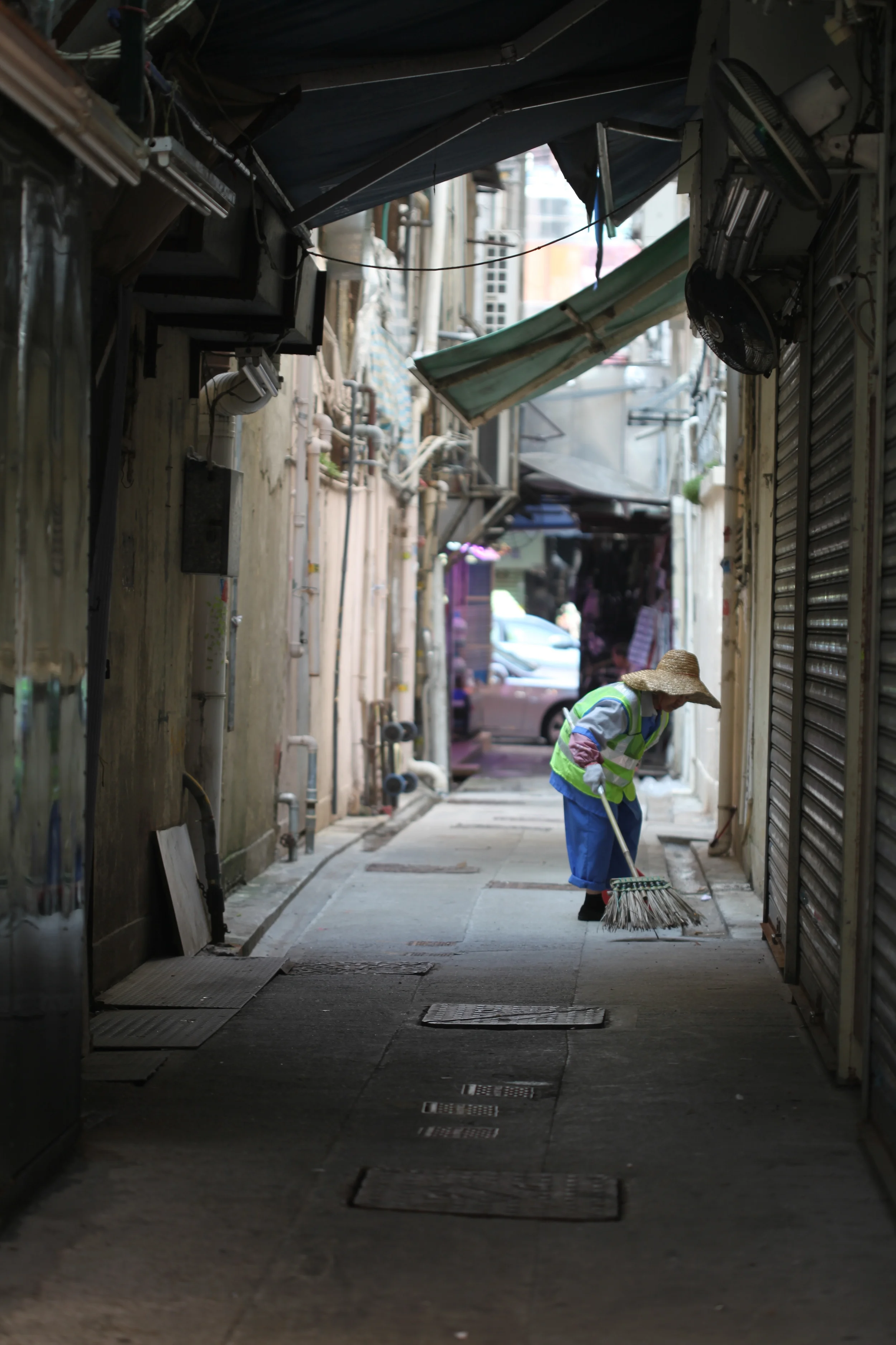 woman sweeping, hong kong