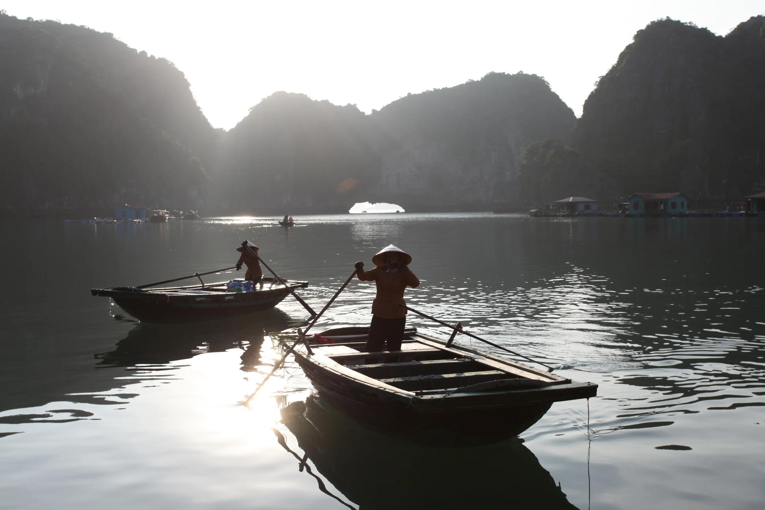 women and boats, halong bay, vietnam